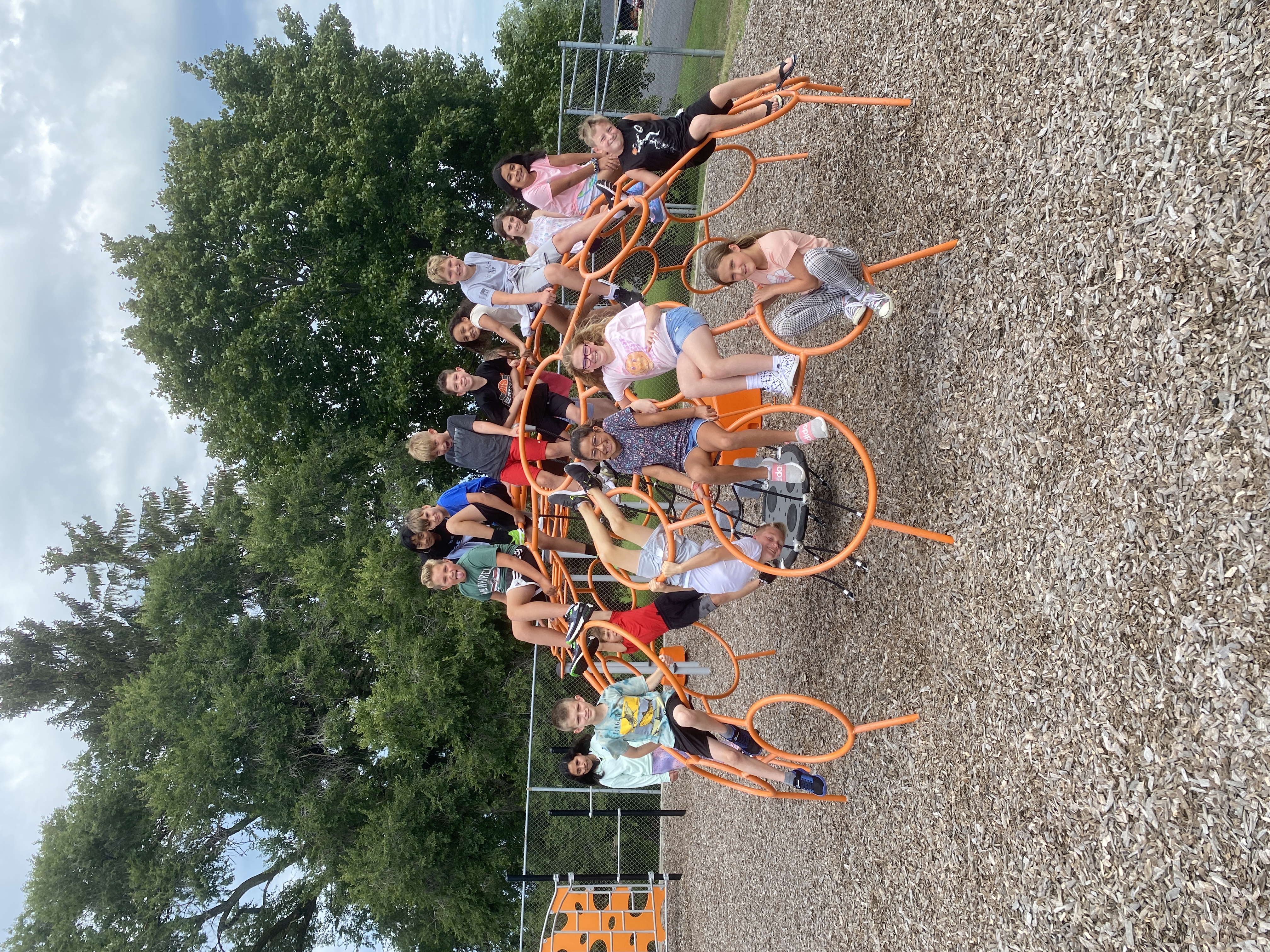 Students climbing on the playground equipment