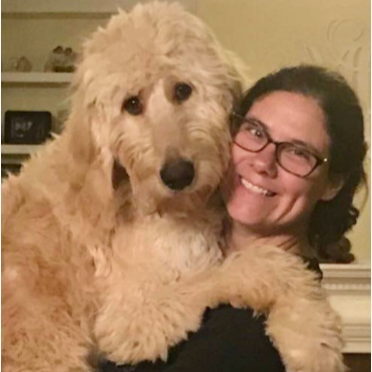 Sharon Cox holding her dog