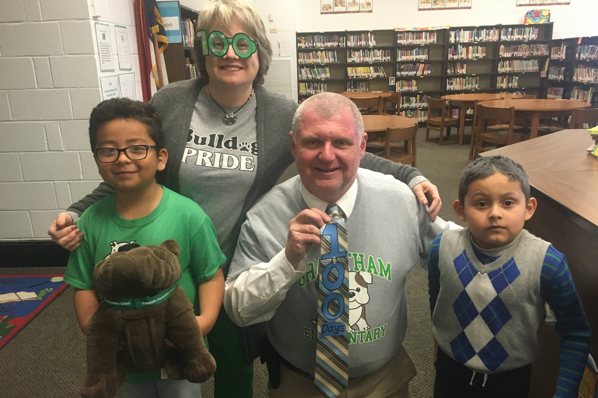 Students celebrating 100th day of school with staff