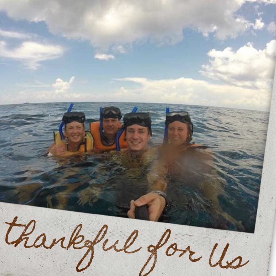 A selfie of Jane Sasser and her family snorkeling in the ocean. 