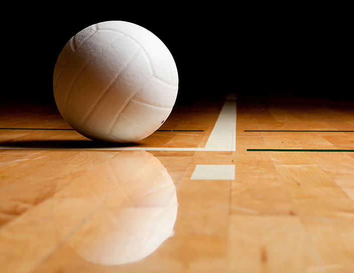 VOLLEYBALL ON COURT FLOOR
