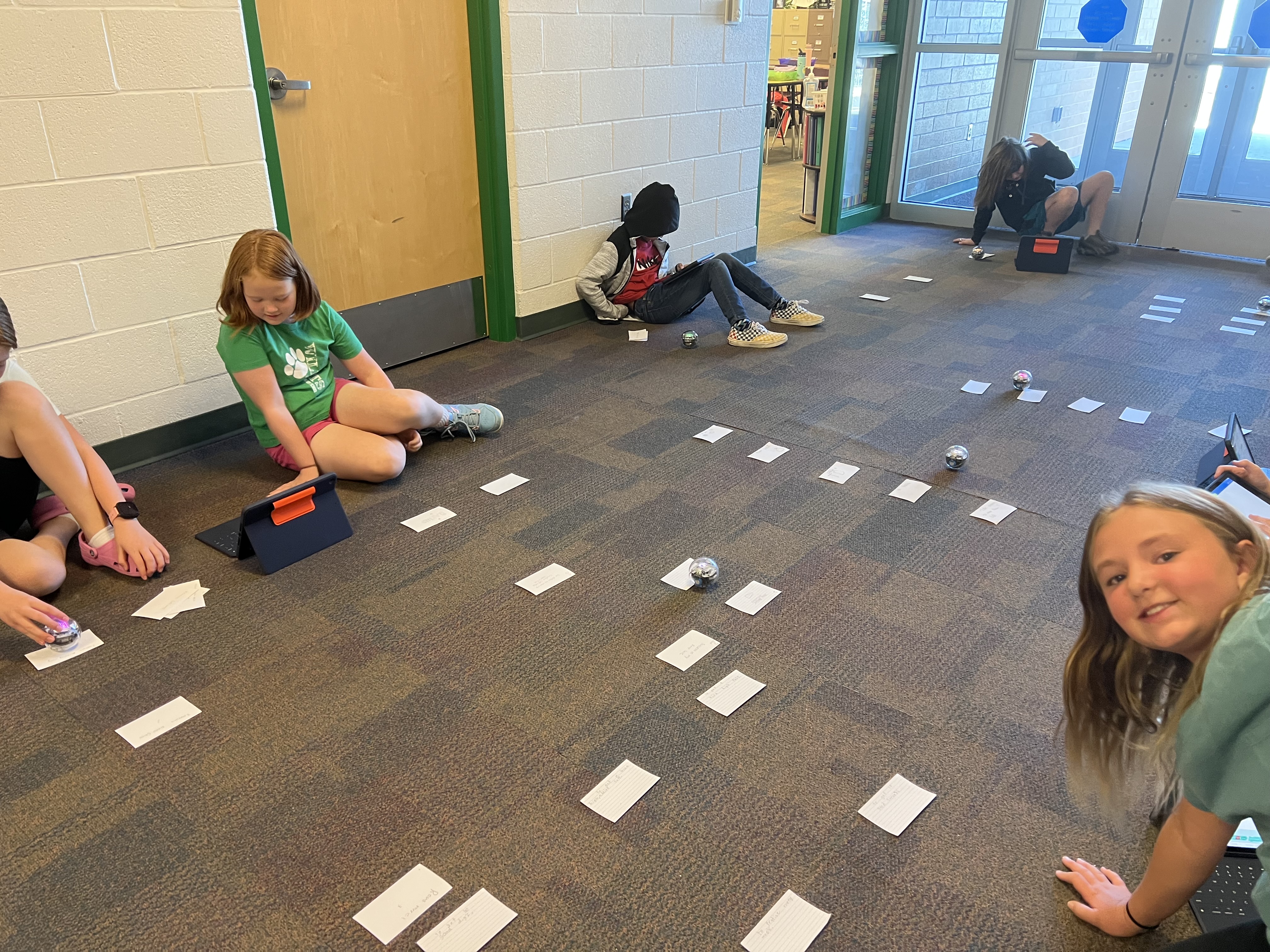 Students using robots in South Summit Middle School in a vision board.