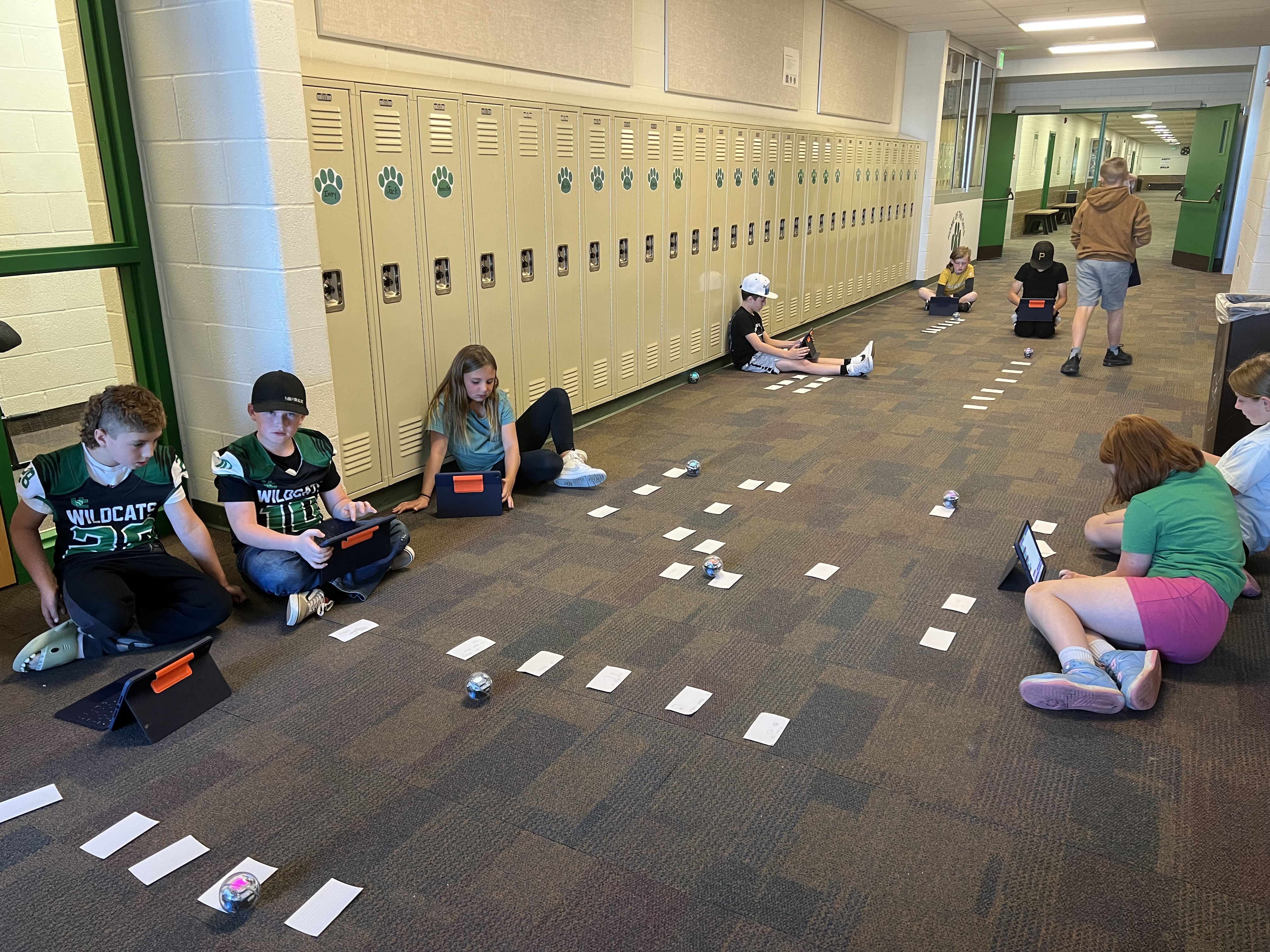 Students using robots in South Summit Middle School in a vision board.