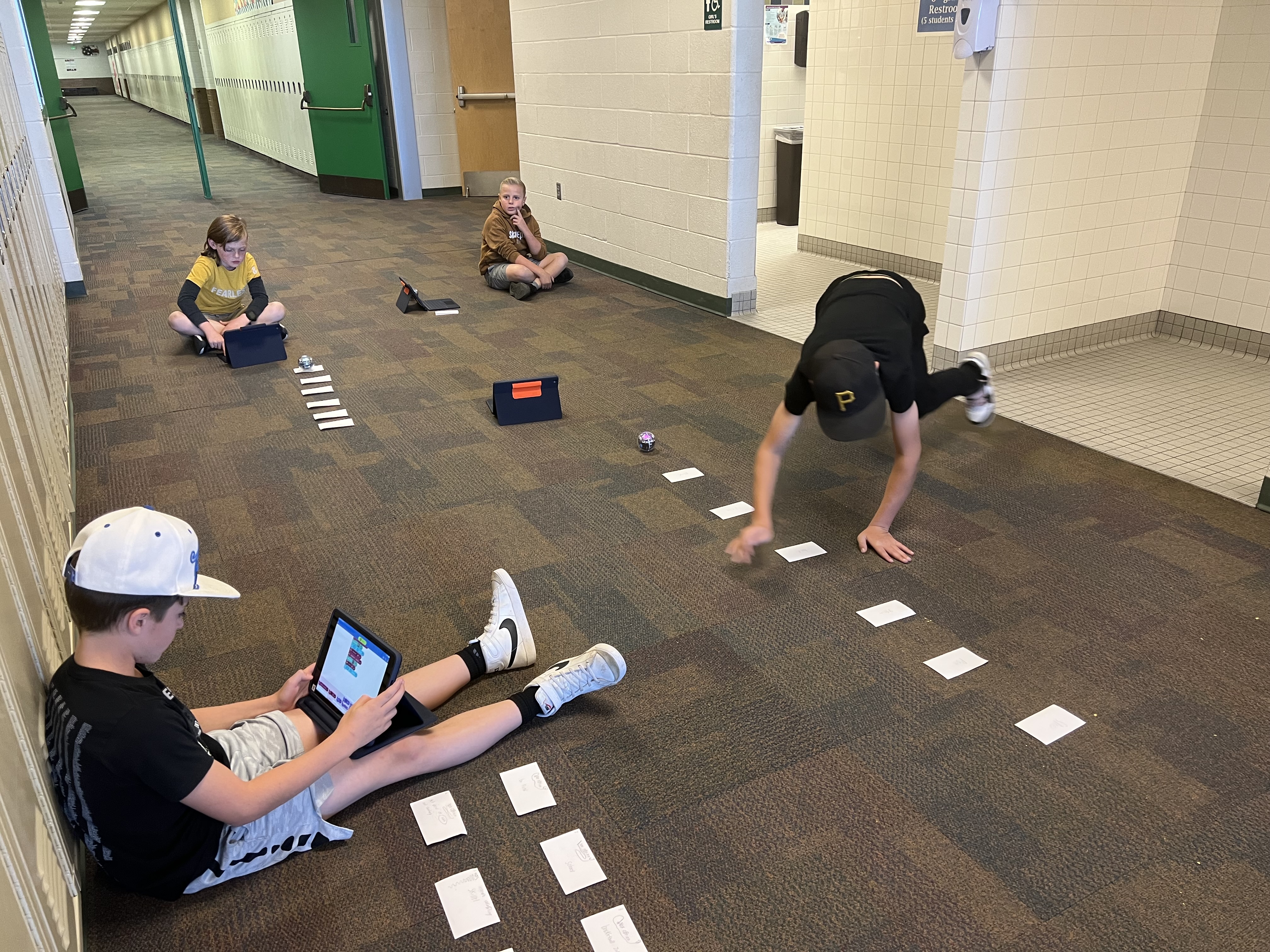 Students using robots in South Summit Middle School in a vision board.