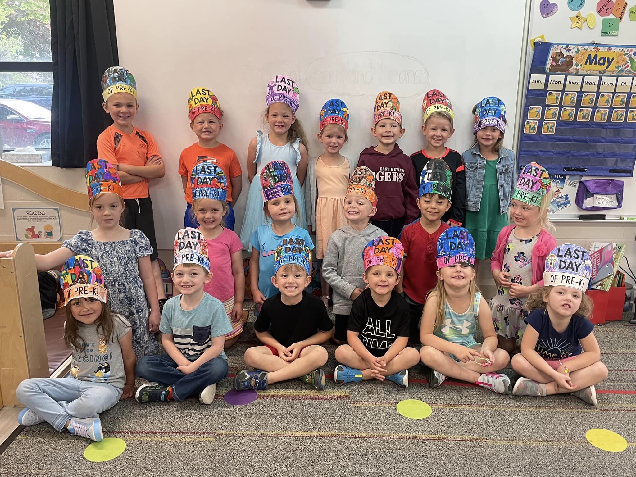 preschool students wearing crowns that say "the last day of school"