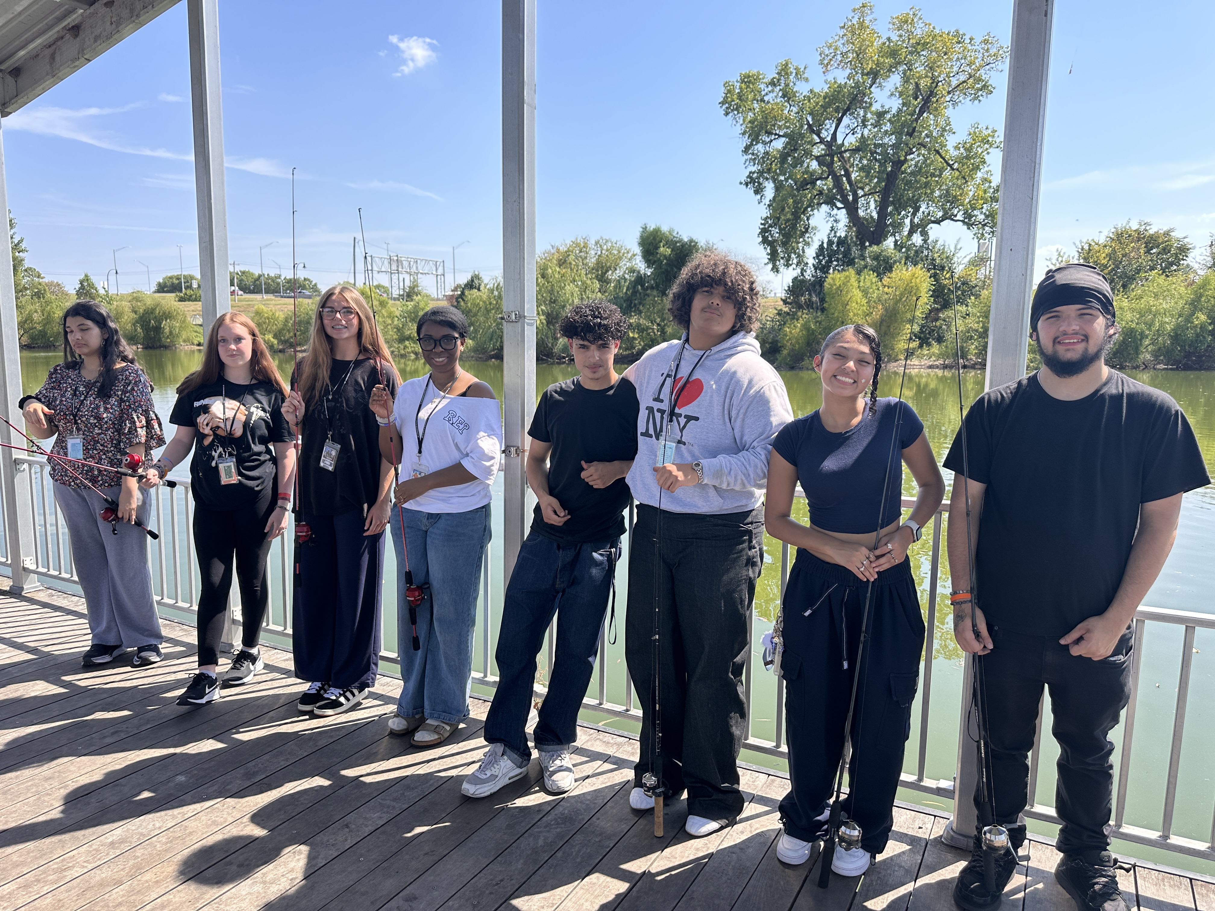A group of students with fishing poles