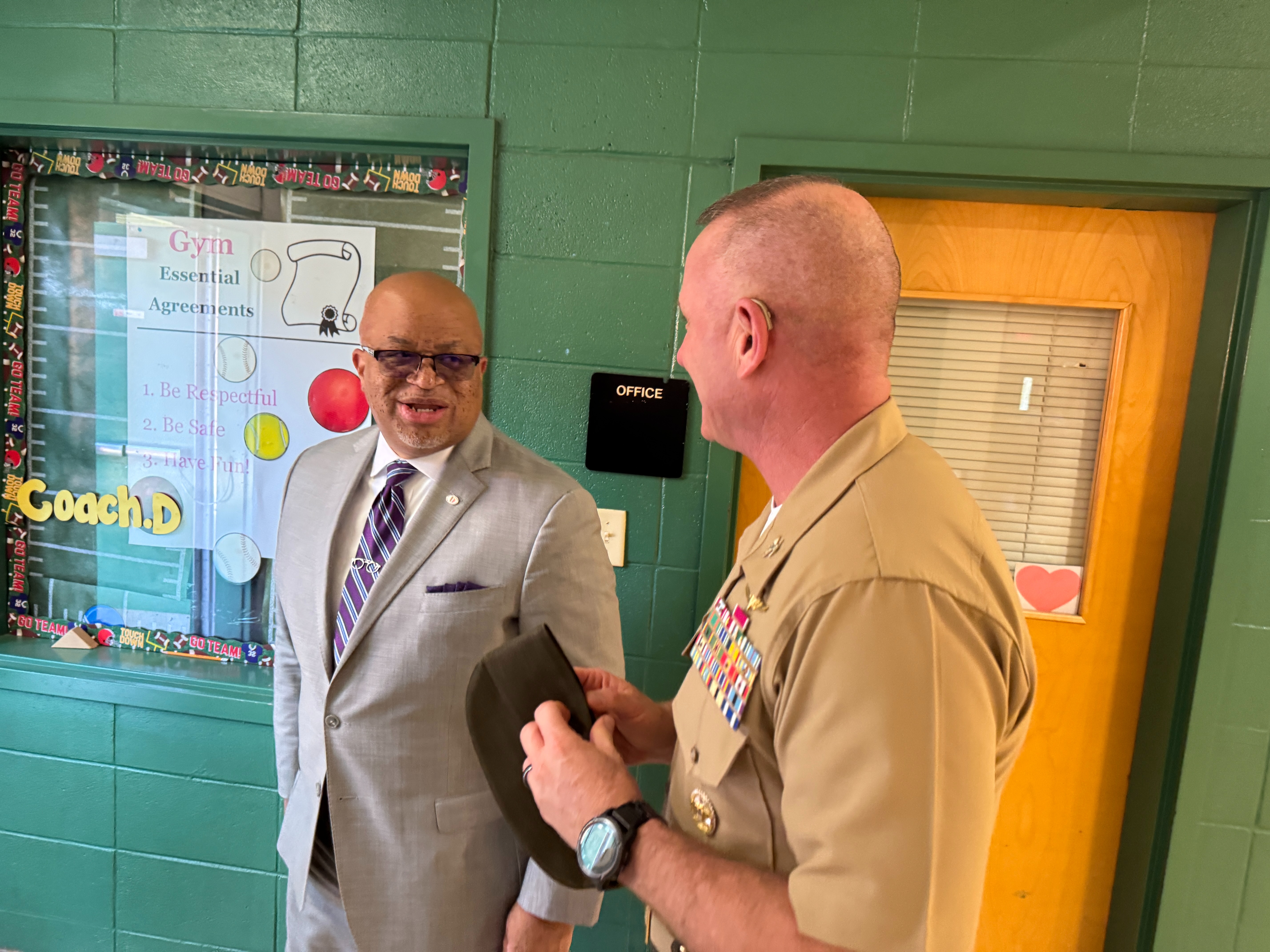 Kenneth Dyer speaking to a Marine