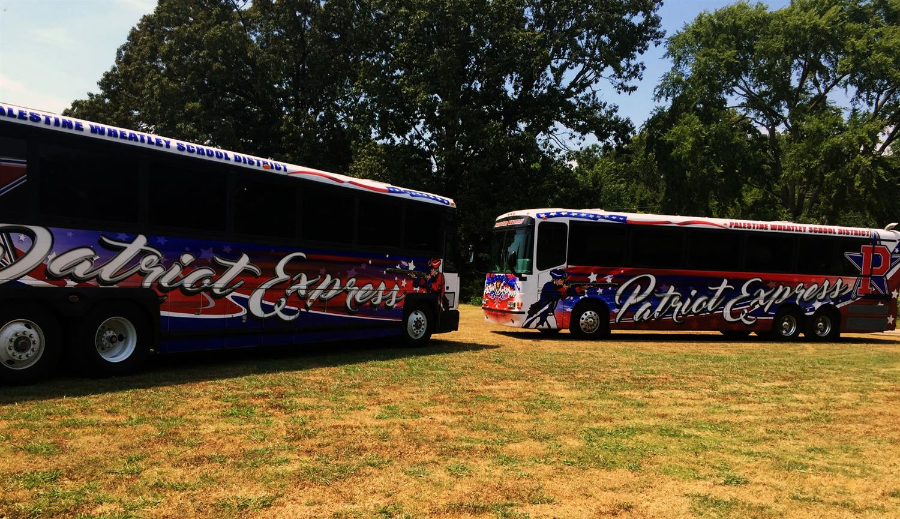 two buses parked next to each other with patriots branding 