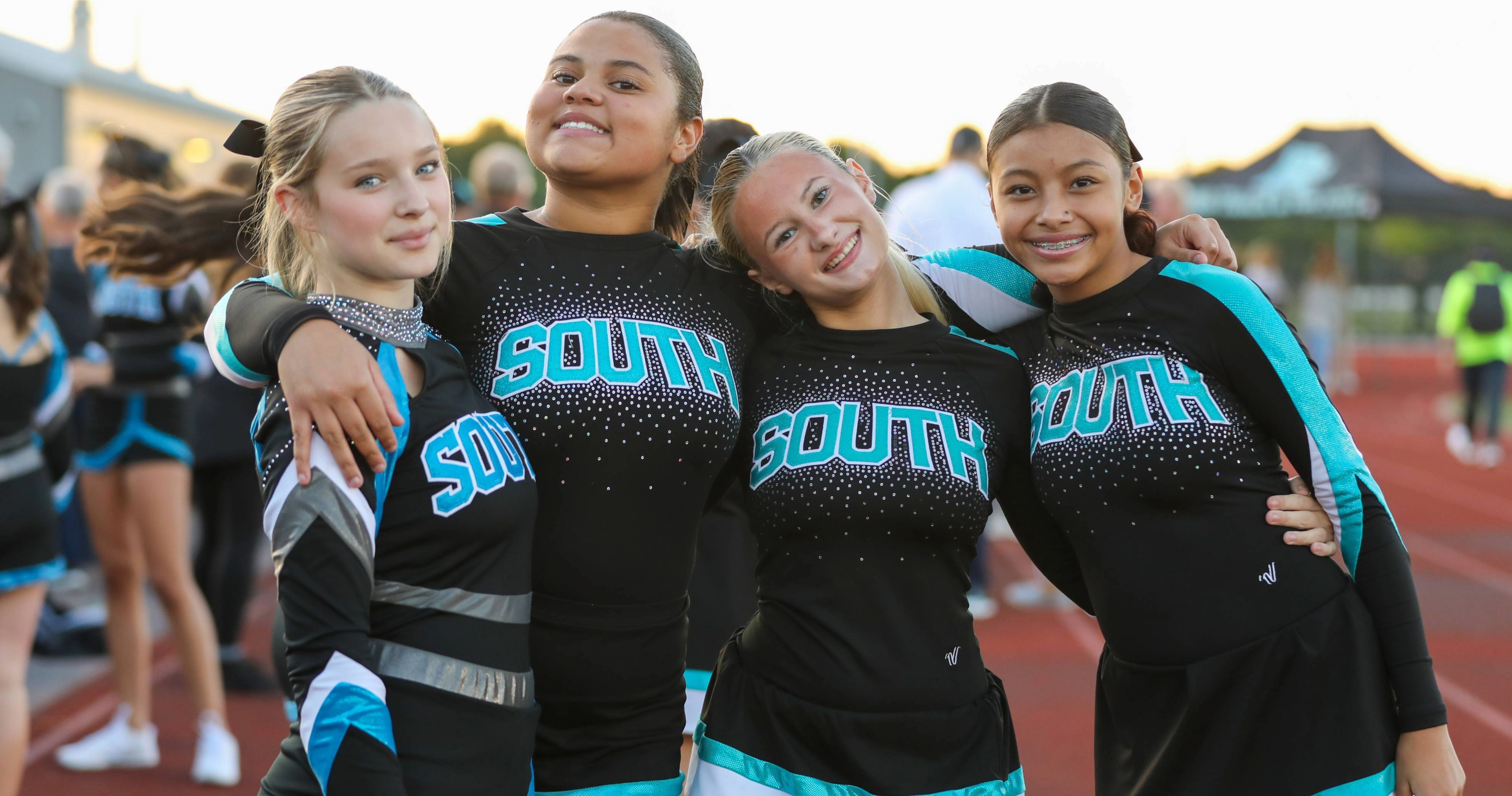 Plymouth South cheerleaders pose on the sidelines.