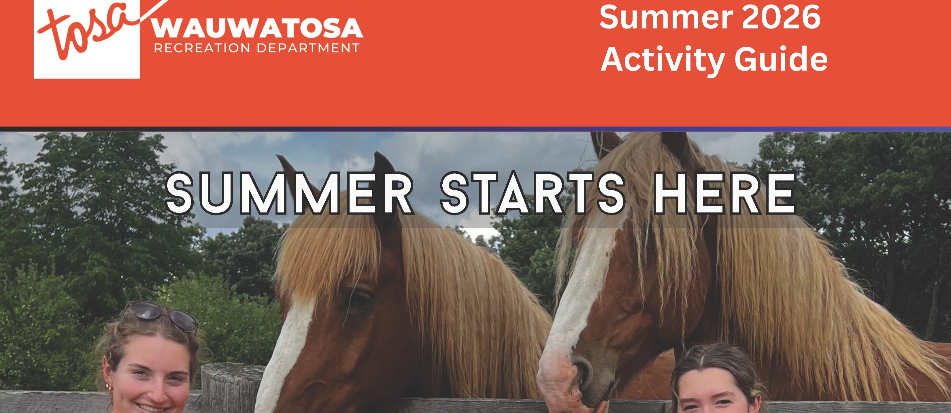 Summer Adventure Club participants wearing orange shirts standing in front of two hourses.