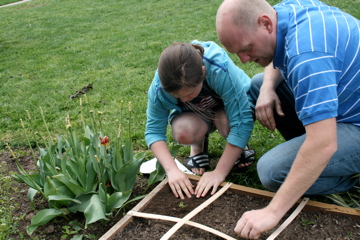 People planting in garden