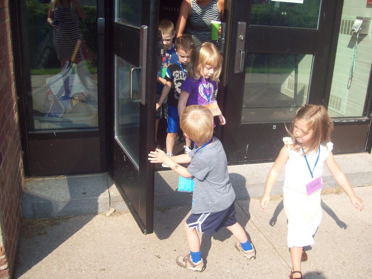 Kid opening the door to other kids