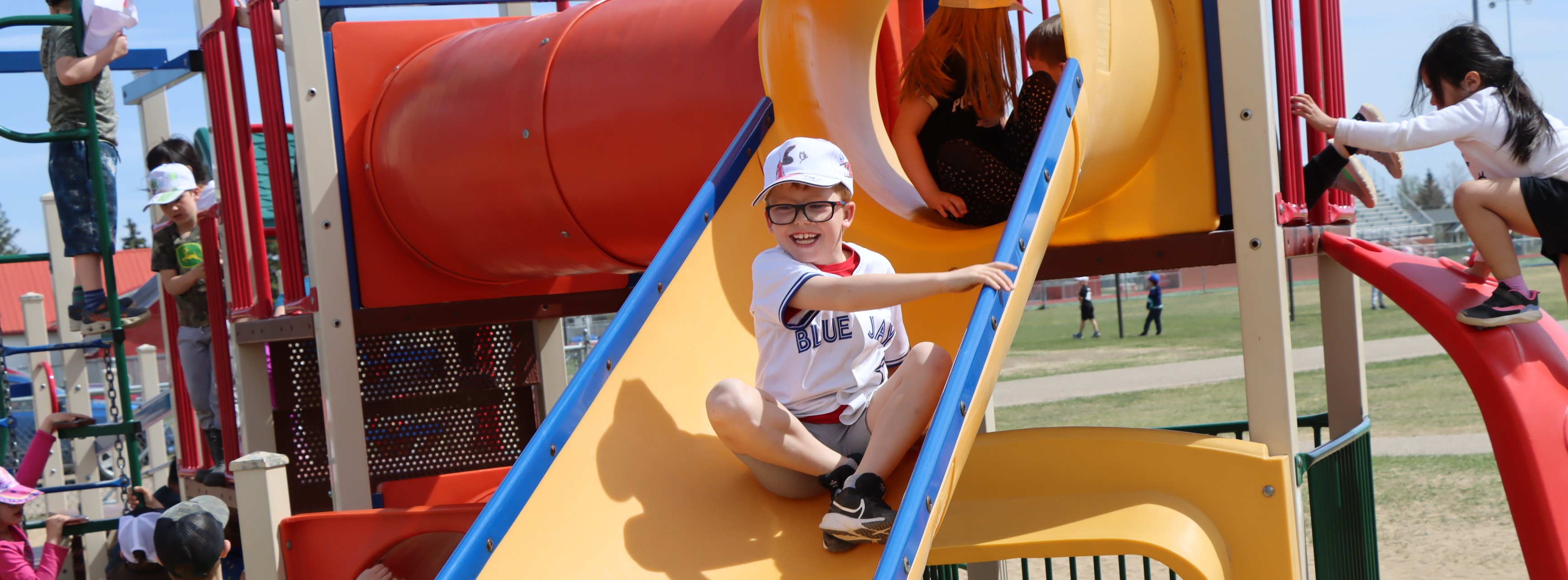 Little boy going down slide