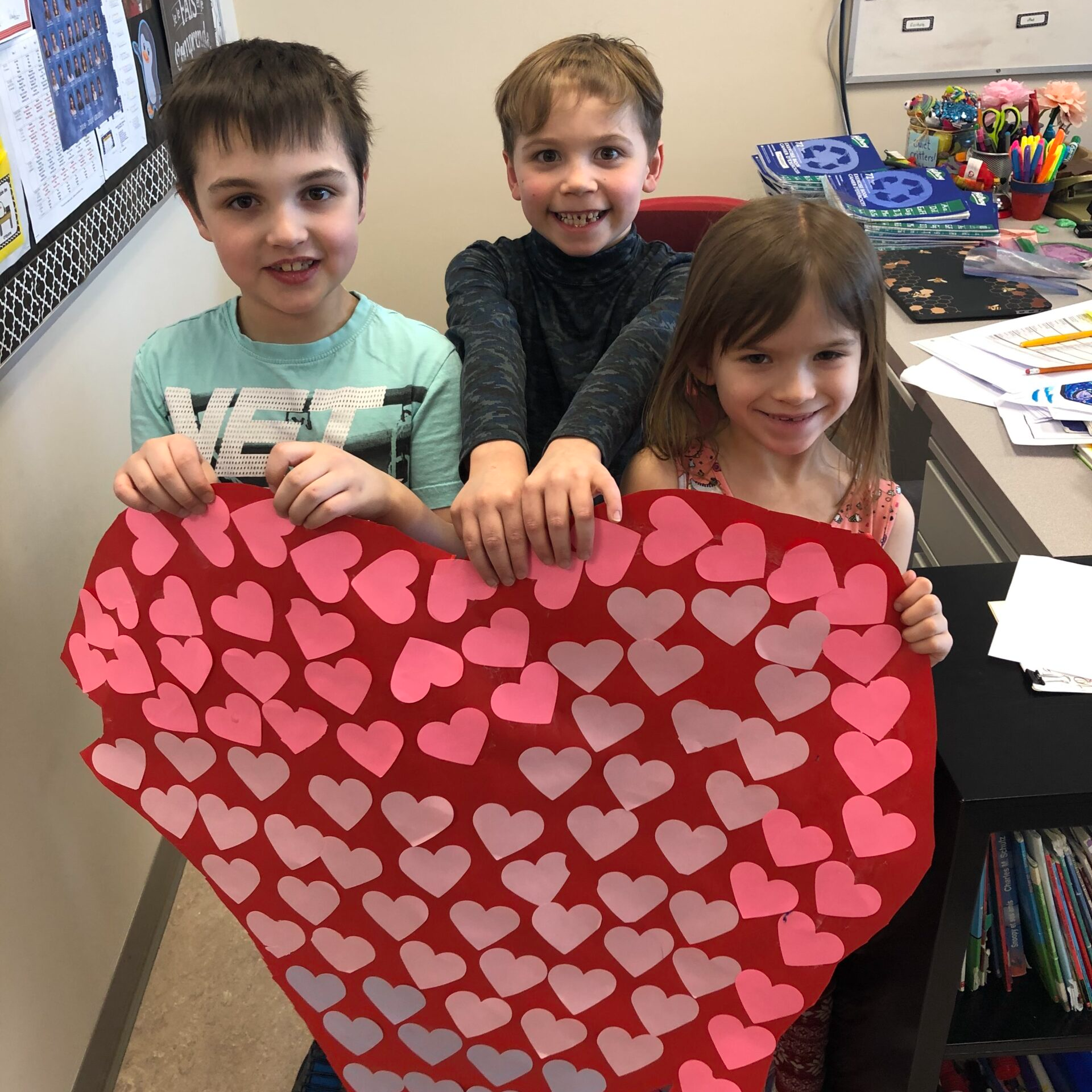kids holding craftt heart-shaped like