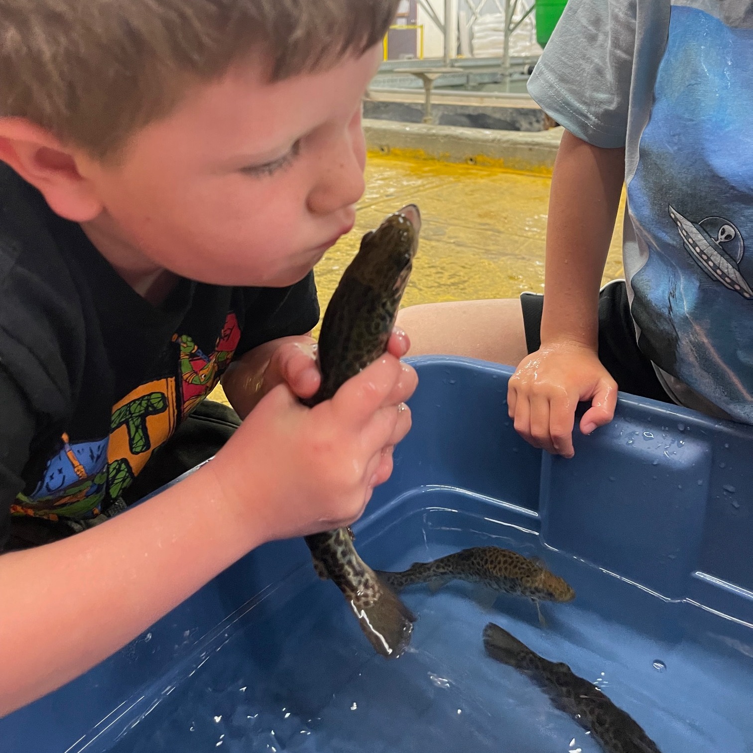 student playing with water