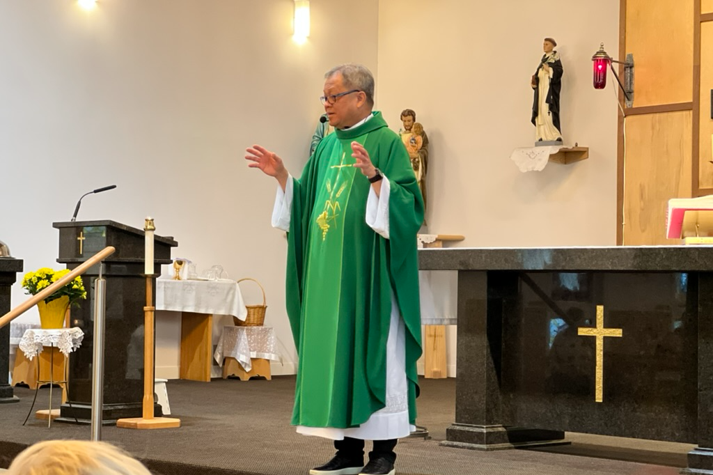 Father Nong giving sermon 