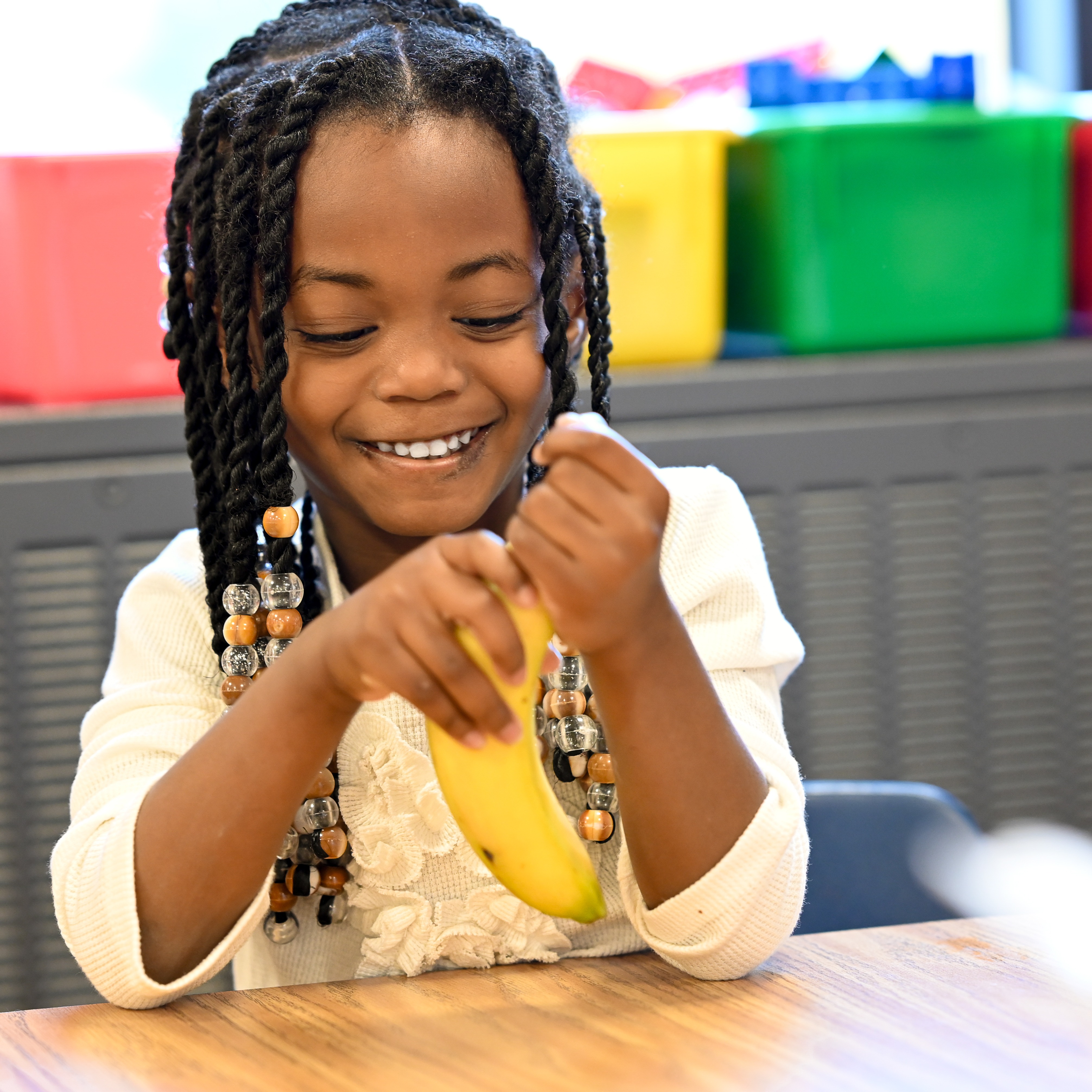 Students eating snack together at the table