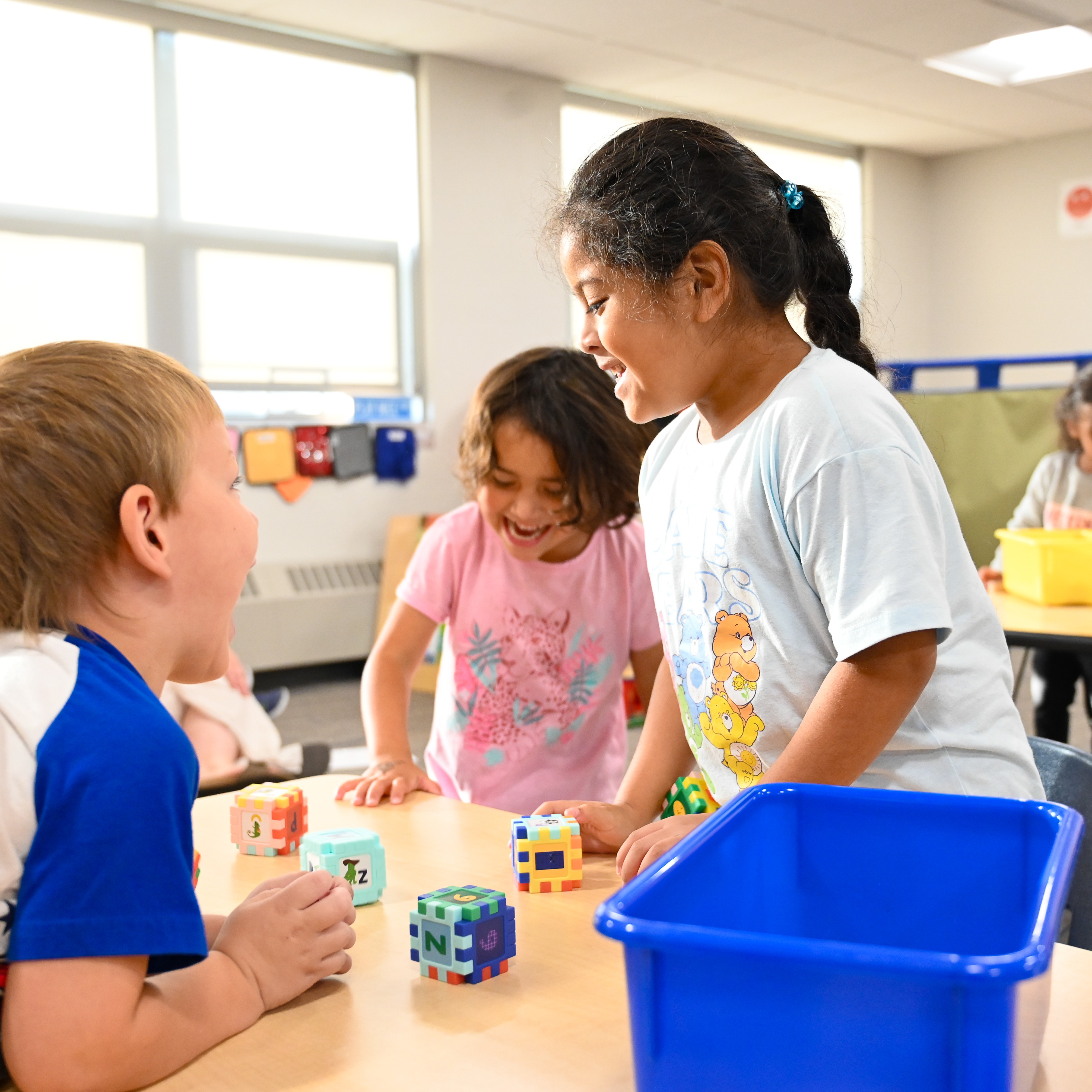 Students playing together building block towers