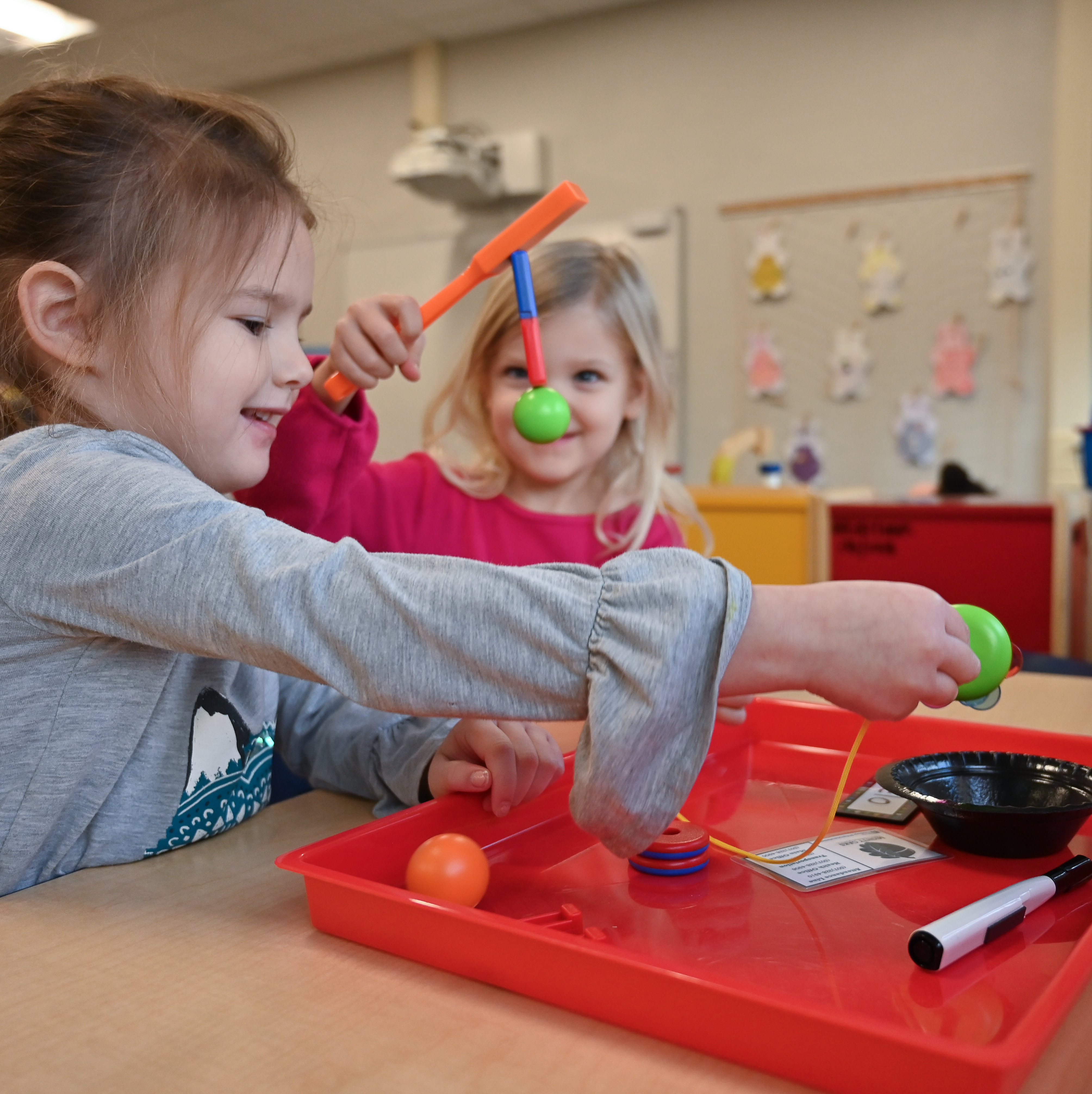 Preschool students playing with magnetic toys