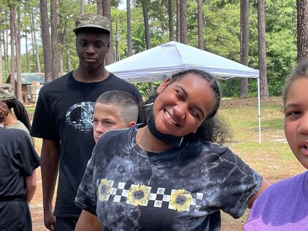 two students smile for the camera