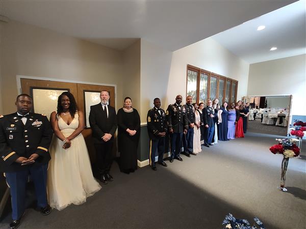 line of people in formal attire