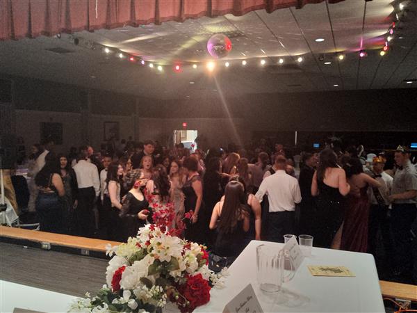 a large group on the dance floor