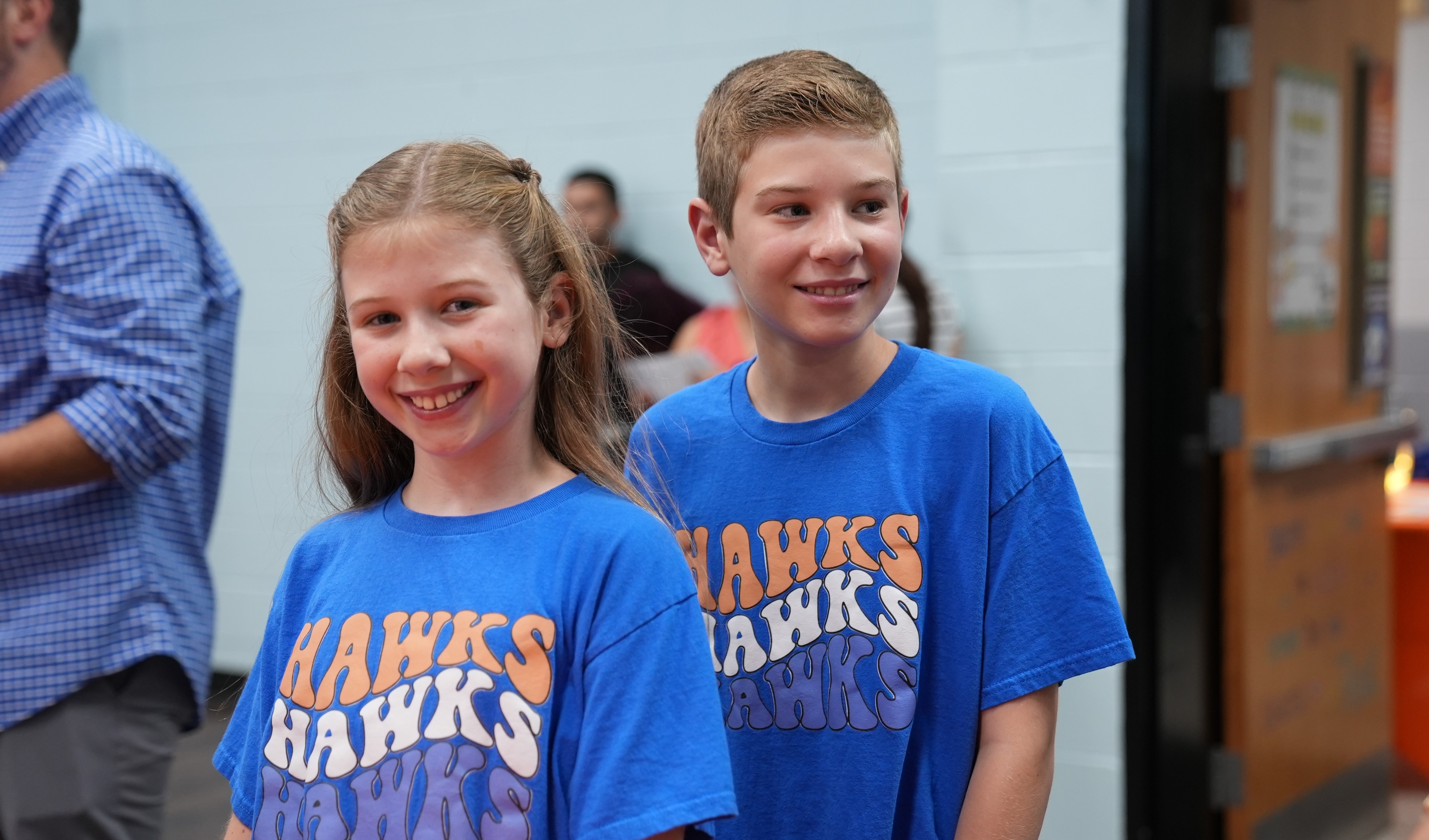 student with Hawks shirt on
