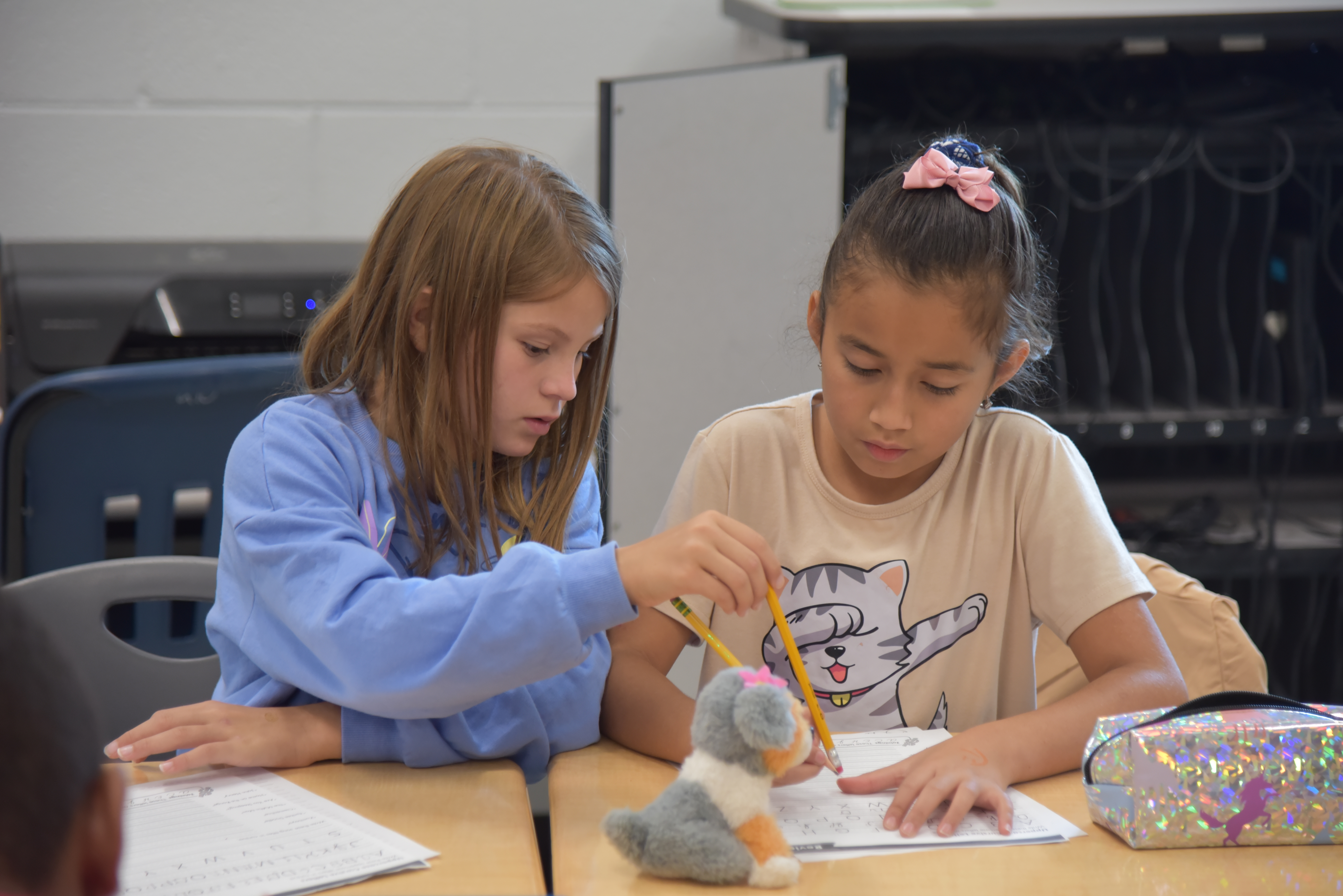 two girls in a BES gifted and talented class working together on a worksheet