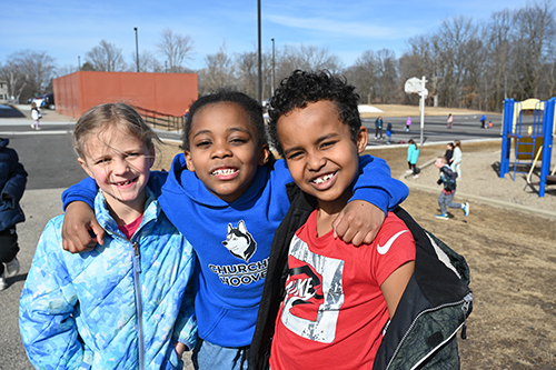 students smiling at the camera