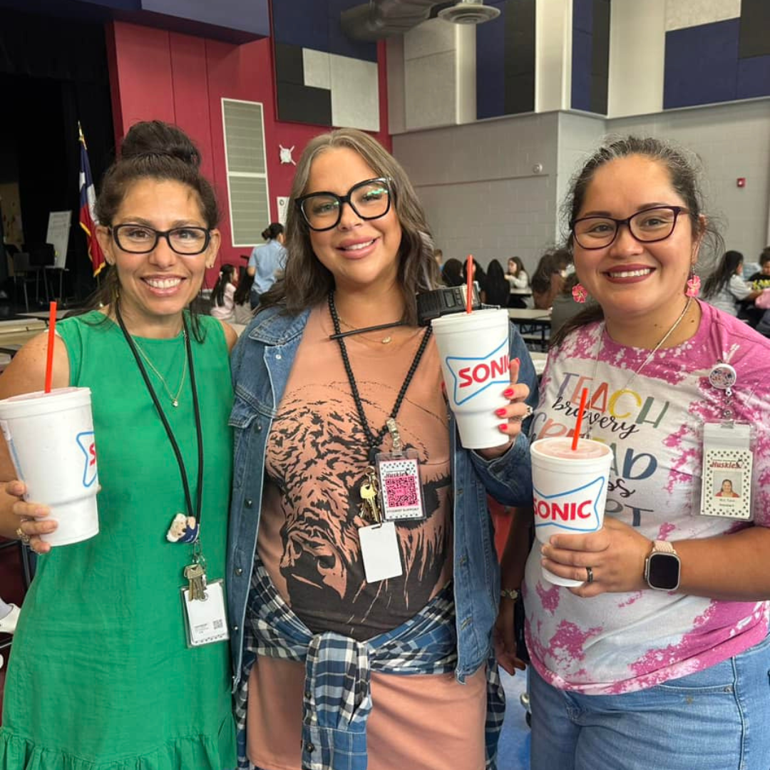 Photo of three staff members including Mrs. Labron