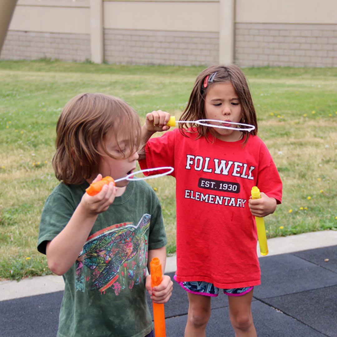 kids blowing bubbles