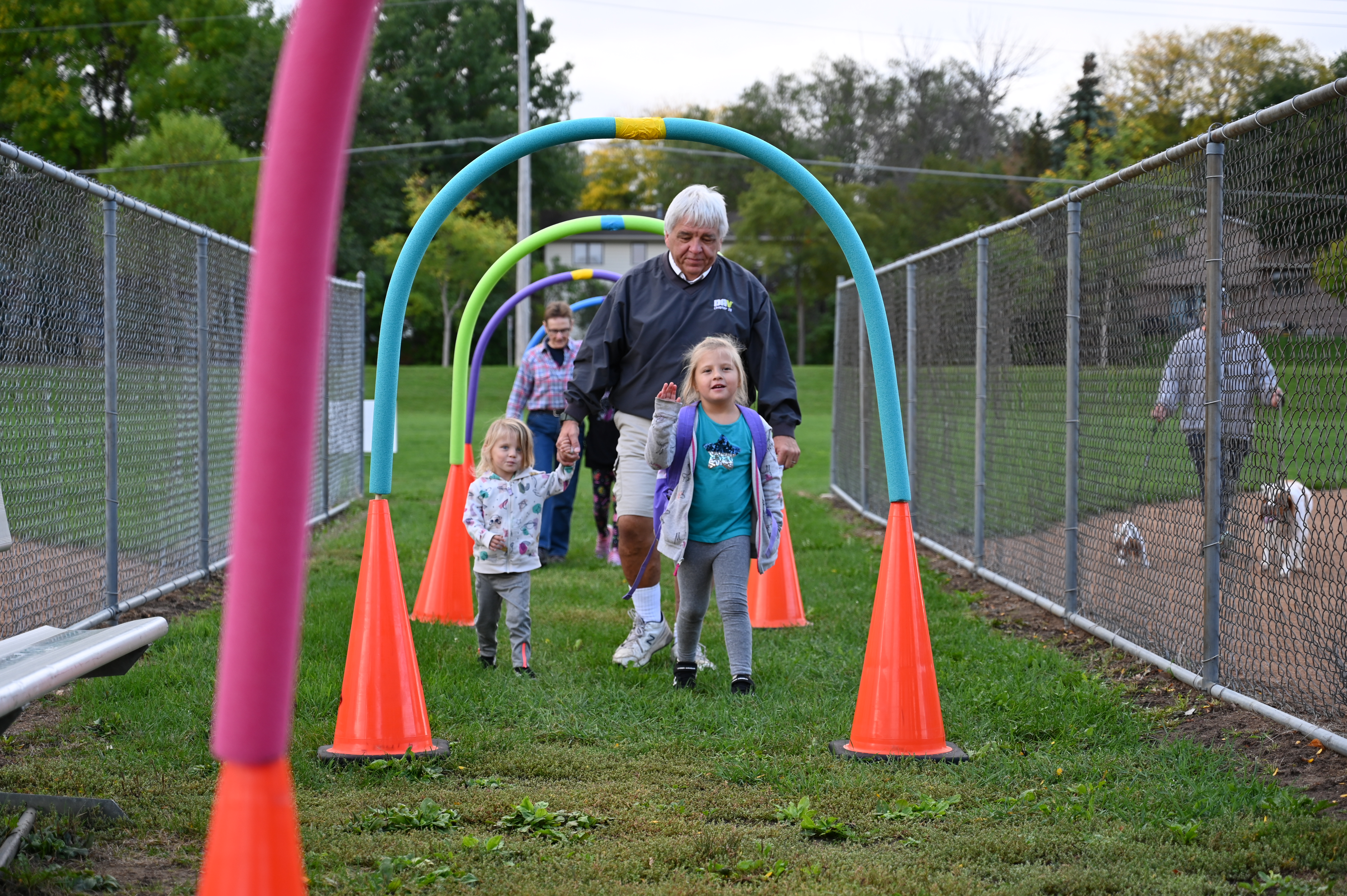 Franklin grandparent and daughters walking to school on walk to school day.
