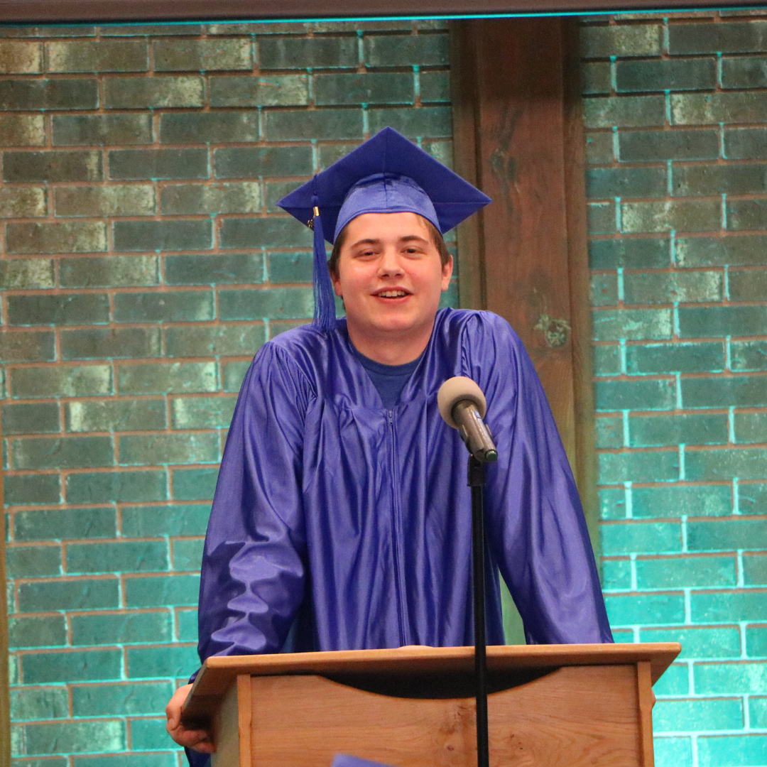 Student Standing at the podium and speaking for Graduation