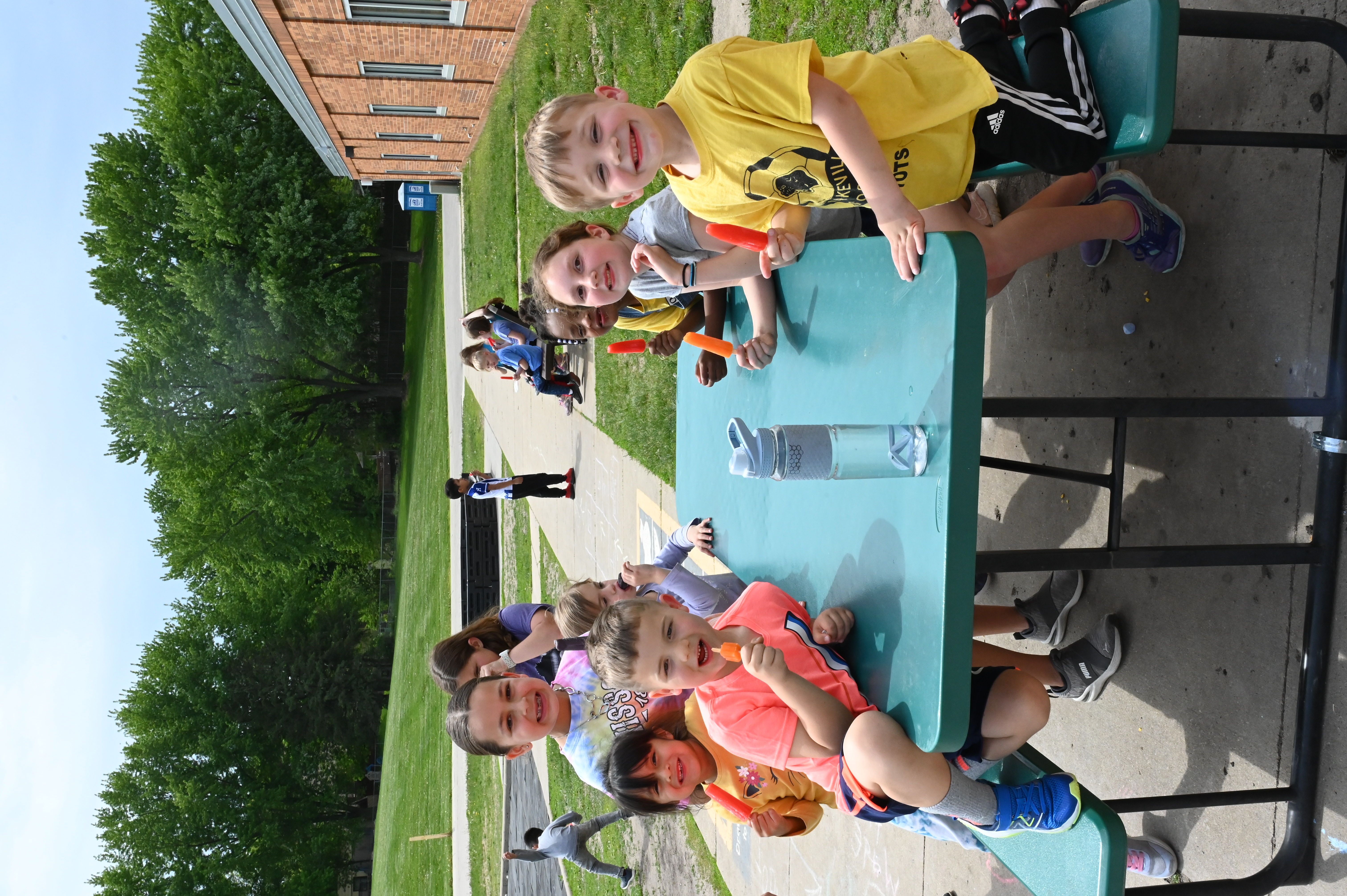Students eating popsicles