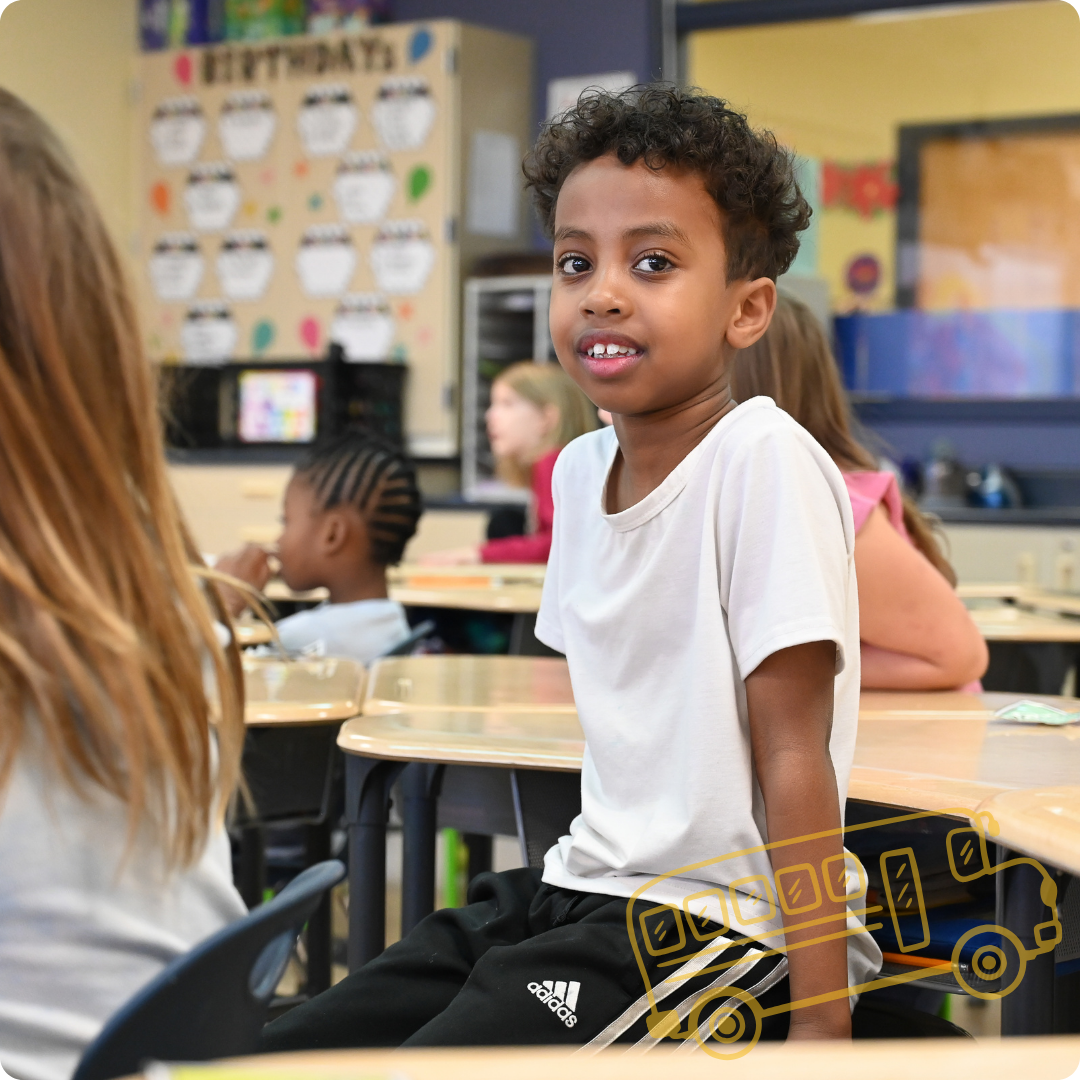 a student smiling at the camera