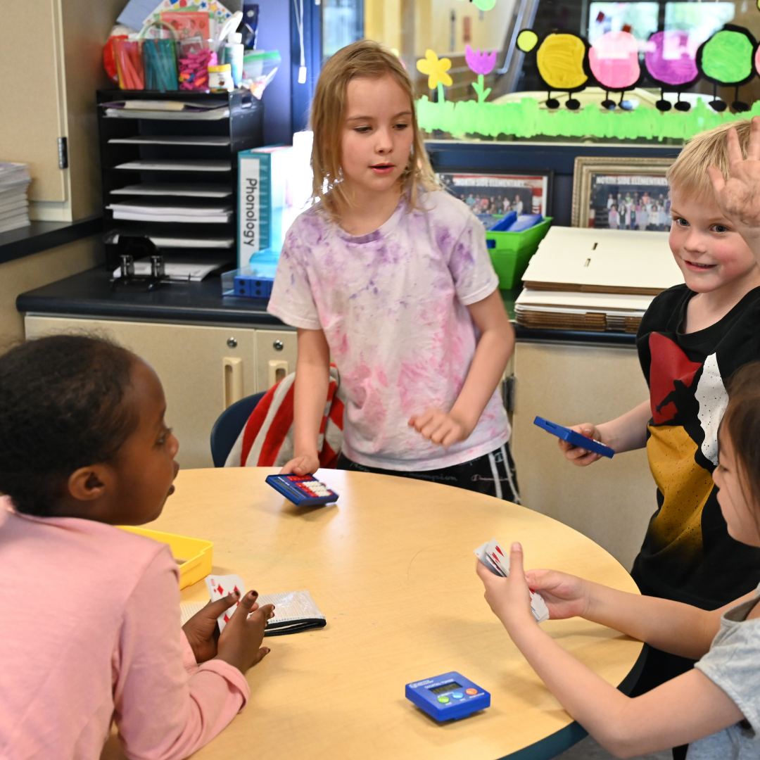 Students working together at a classroom table