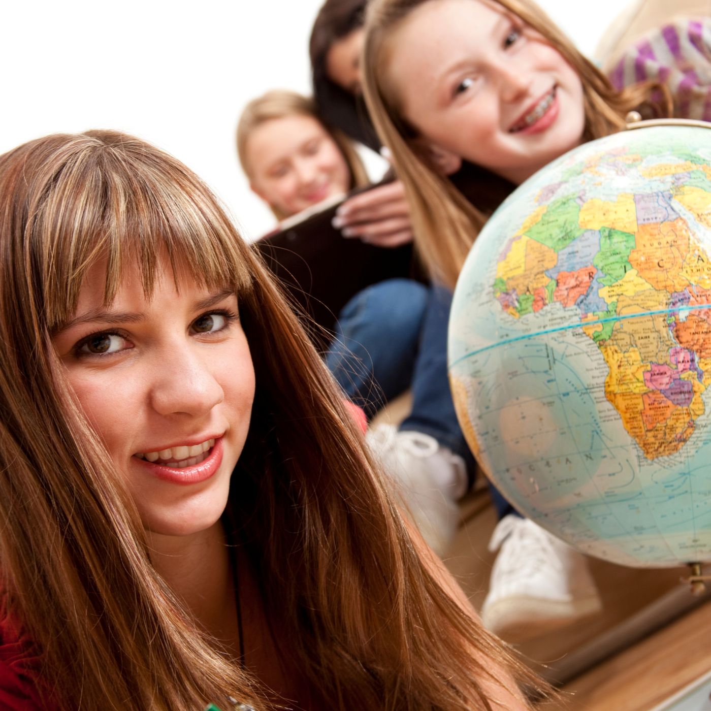 People posing by a globe