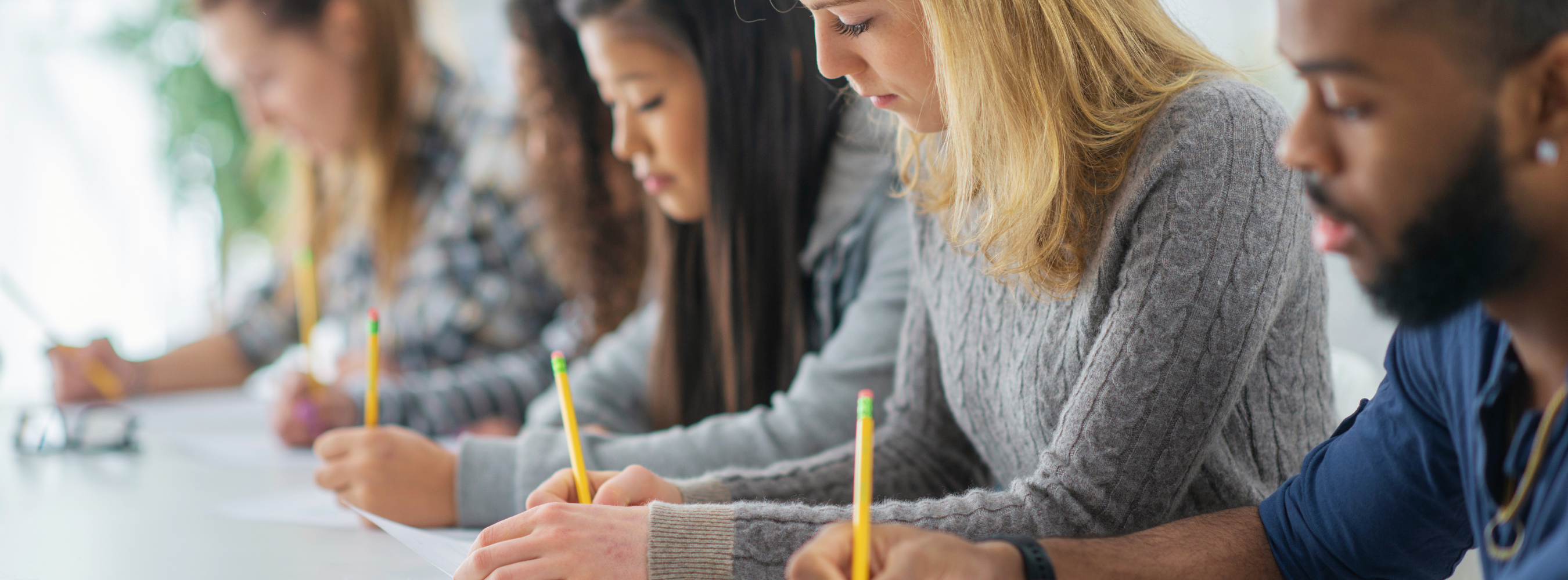 Diverse students taking exams