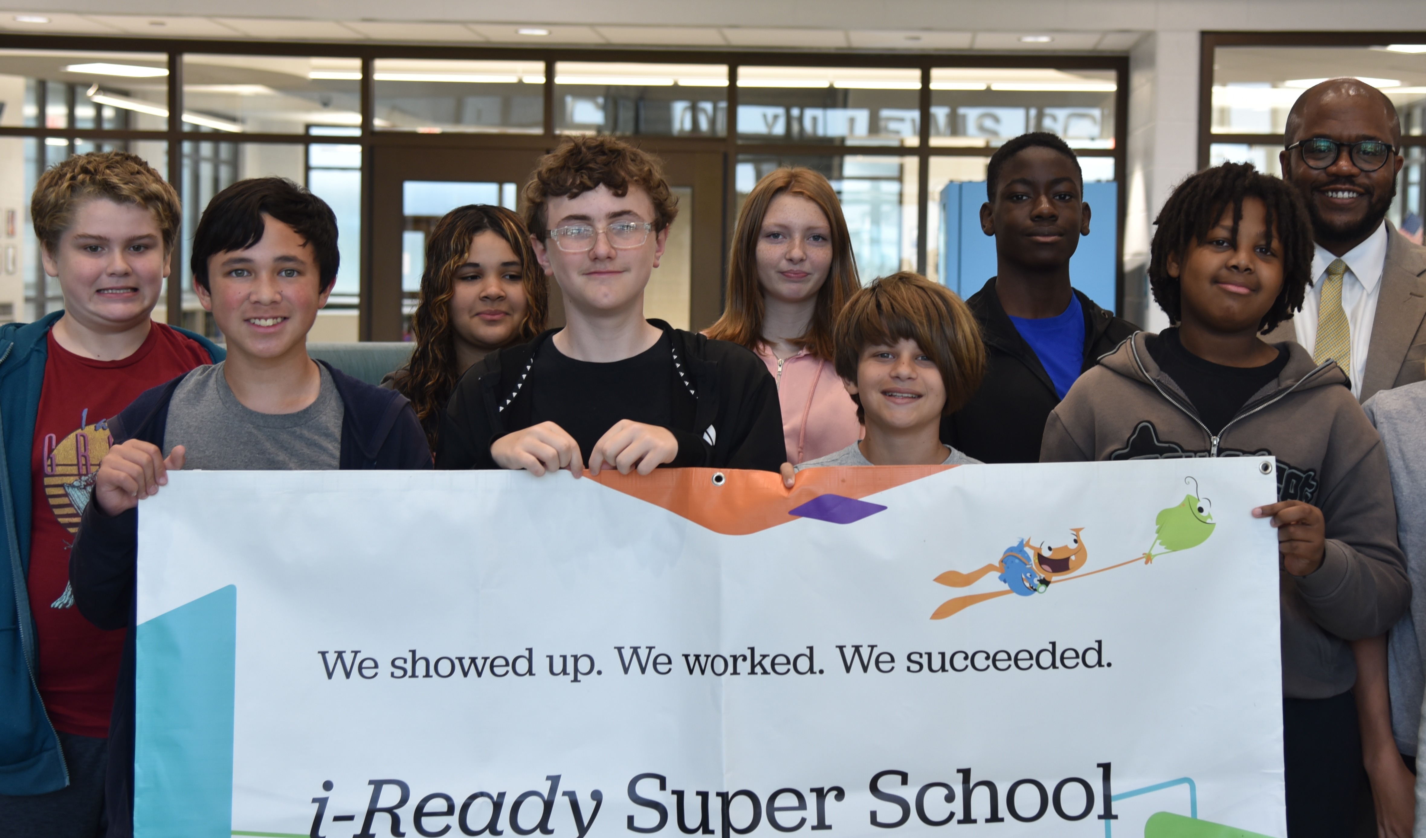 CLS students with i-ready Super School banner