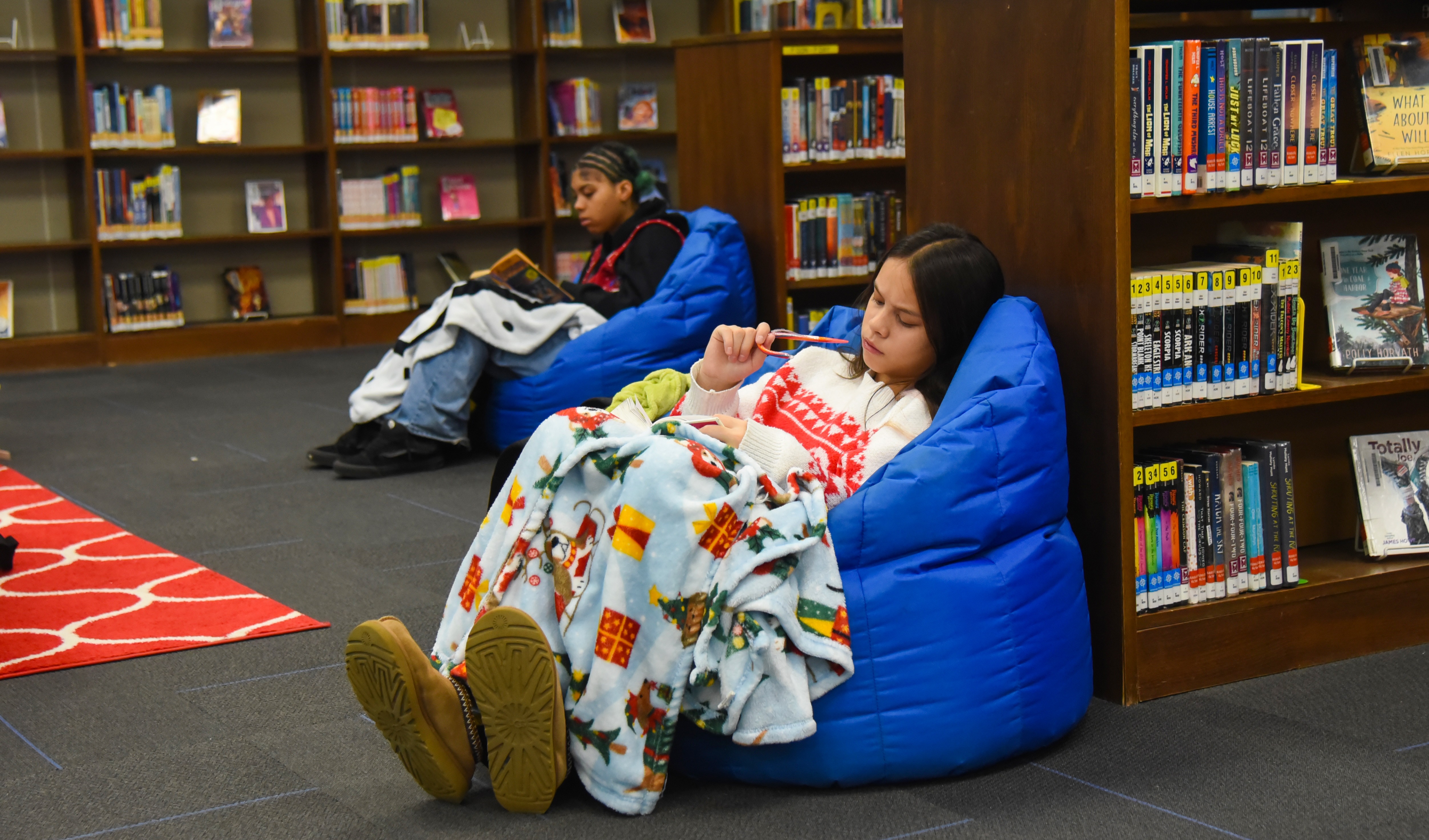 students reading in library