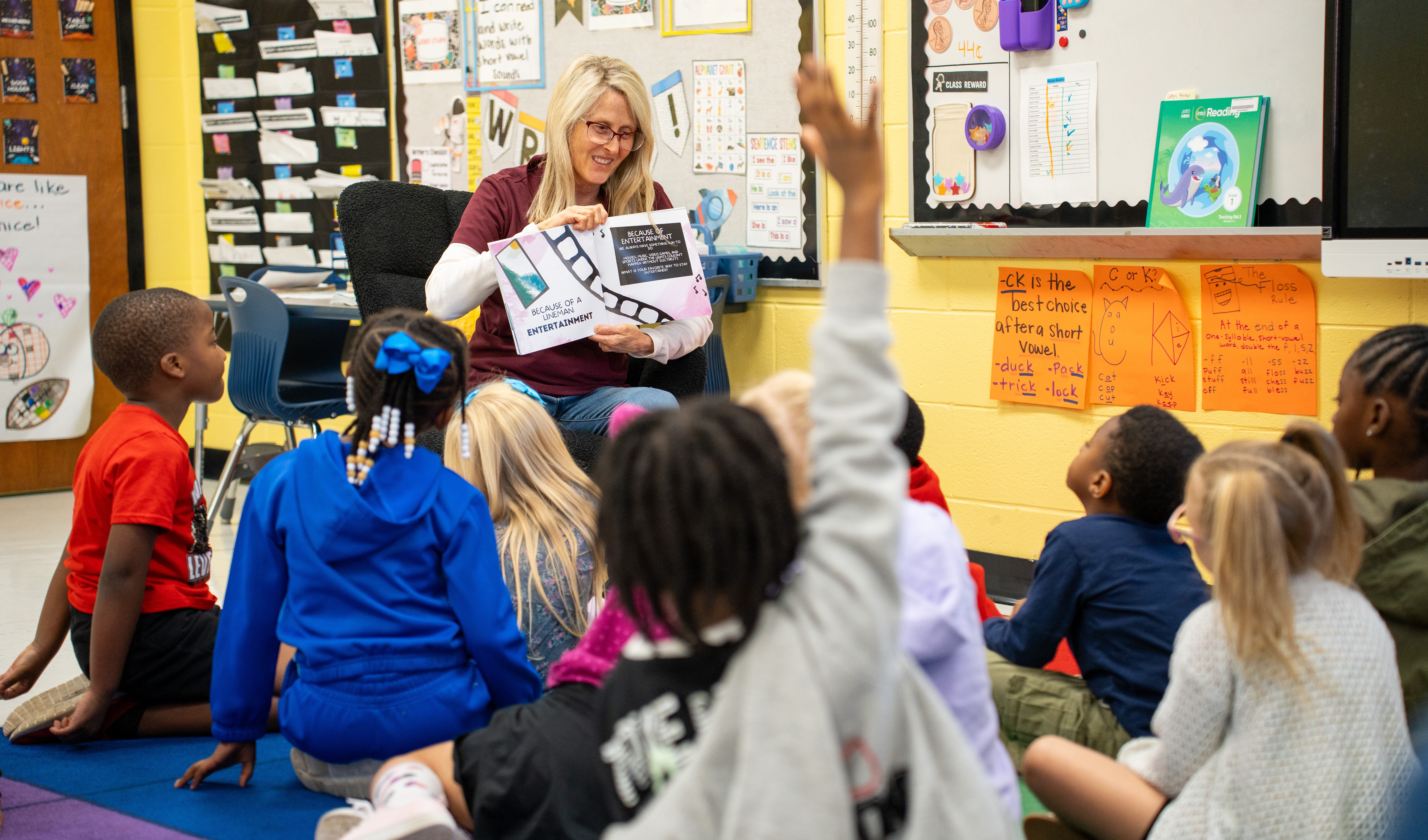 volunteer reading to MCE students