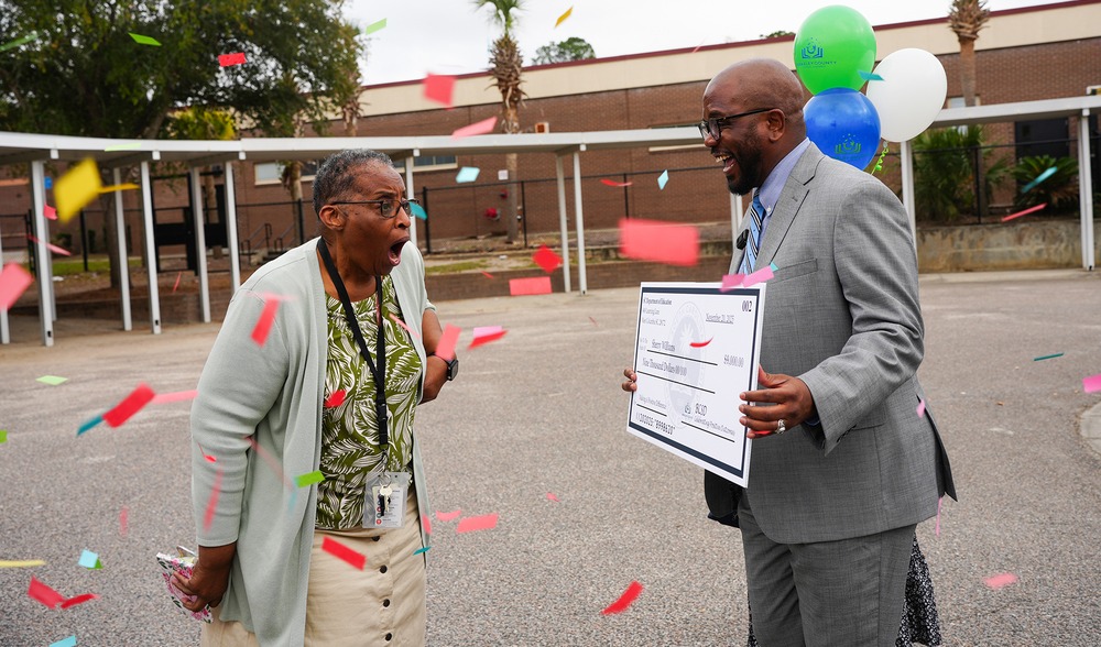teacher getting prize money for improved student test scores