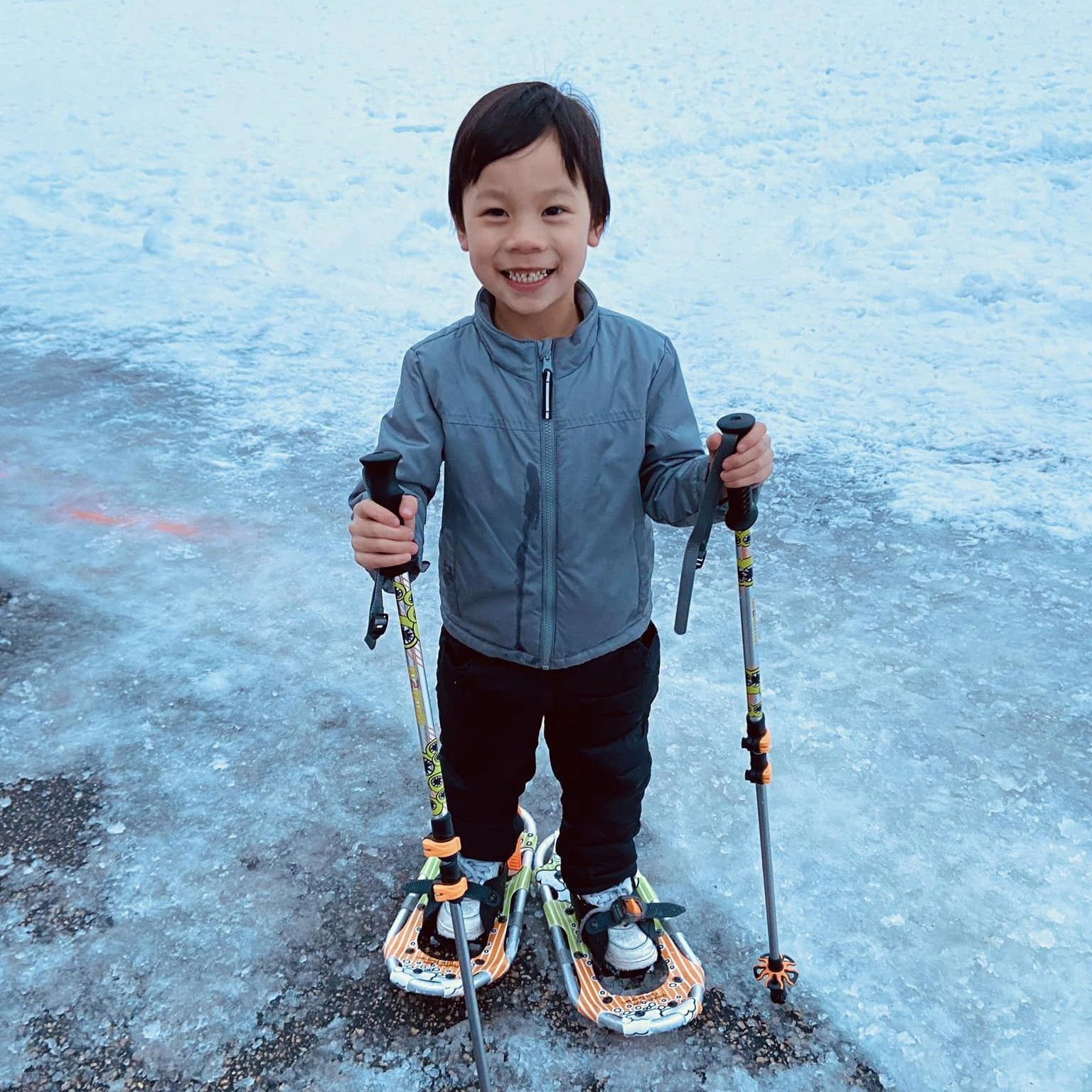 A student snowshoeing during winter