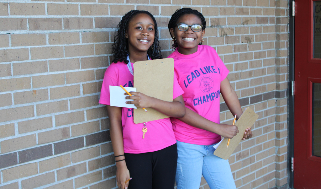 students with clipboards