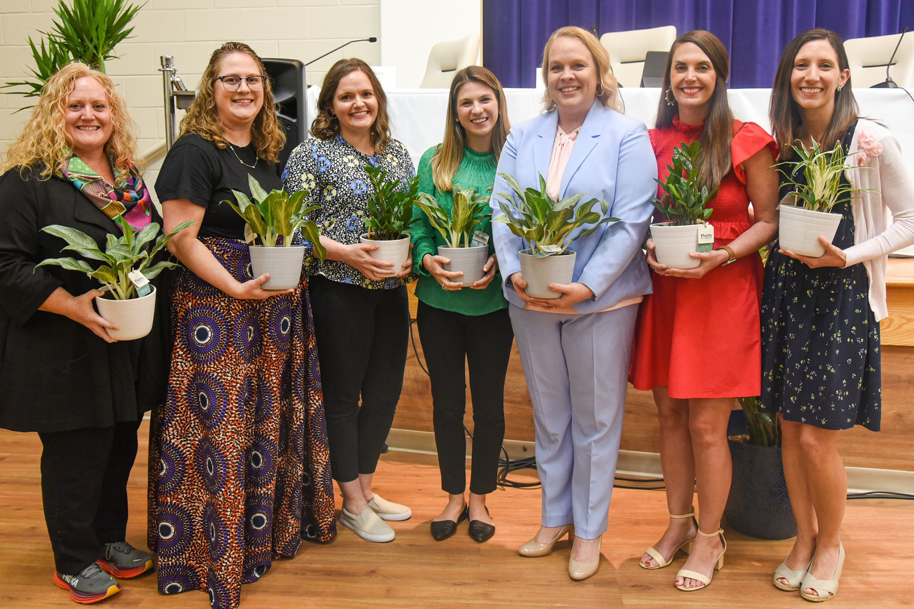 teacher of the year pose for photos