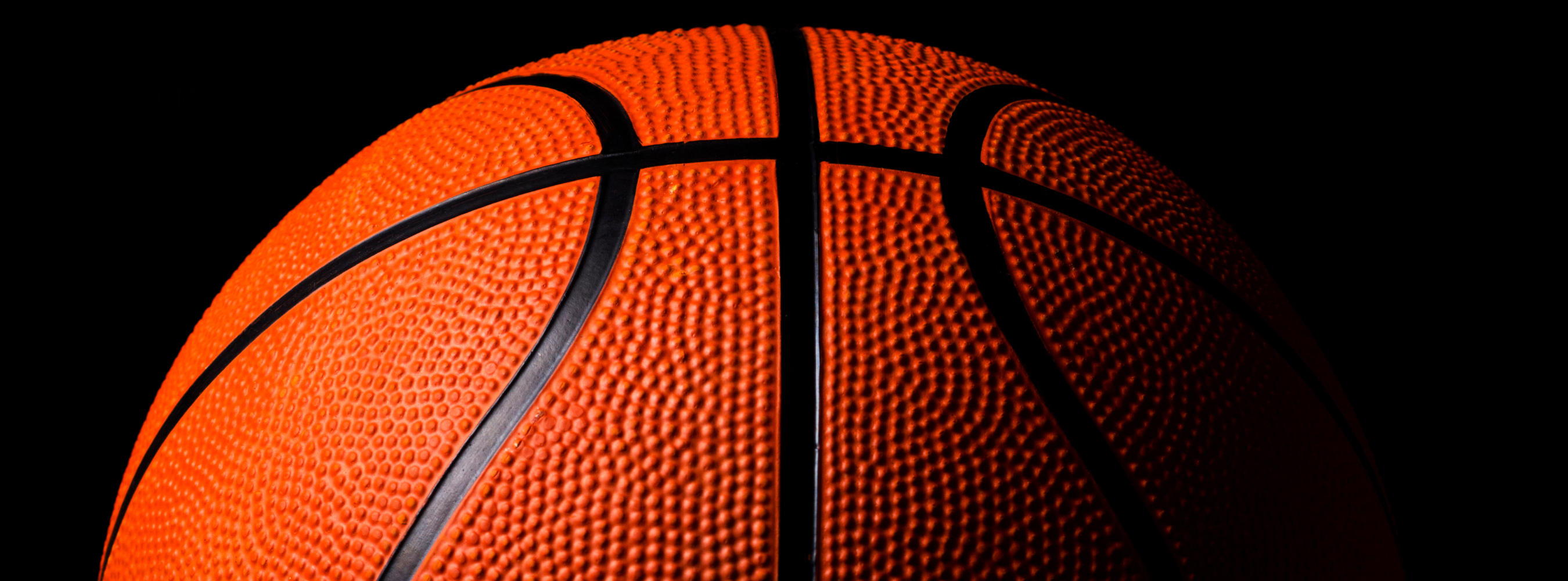 Orange basketball in black background