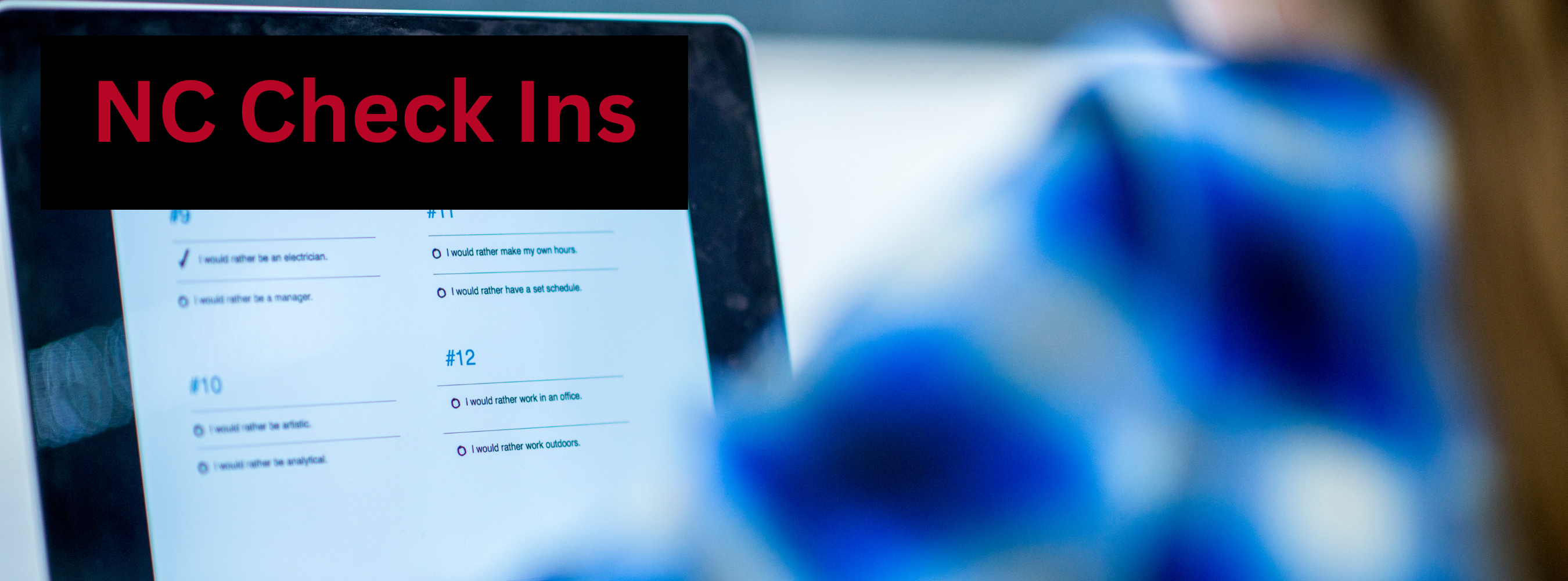 Girl taking a test on a computer and title NC Check Ins 