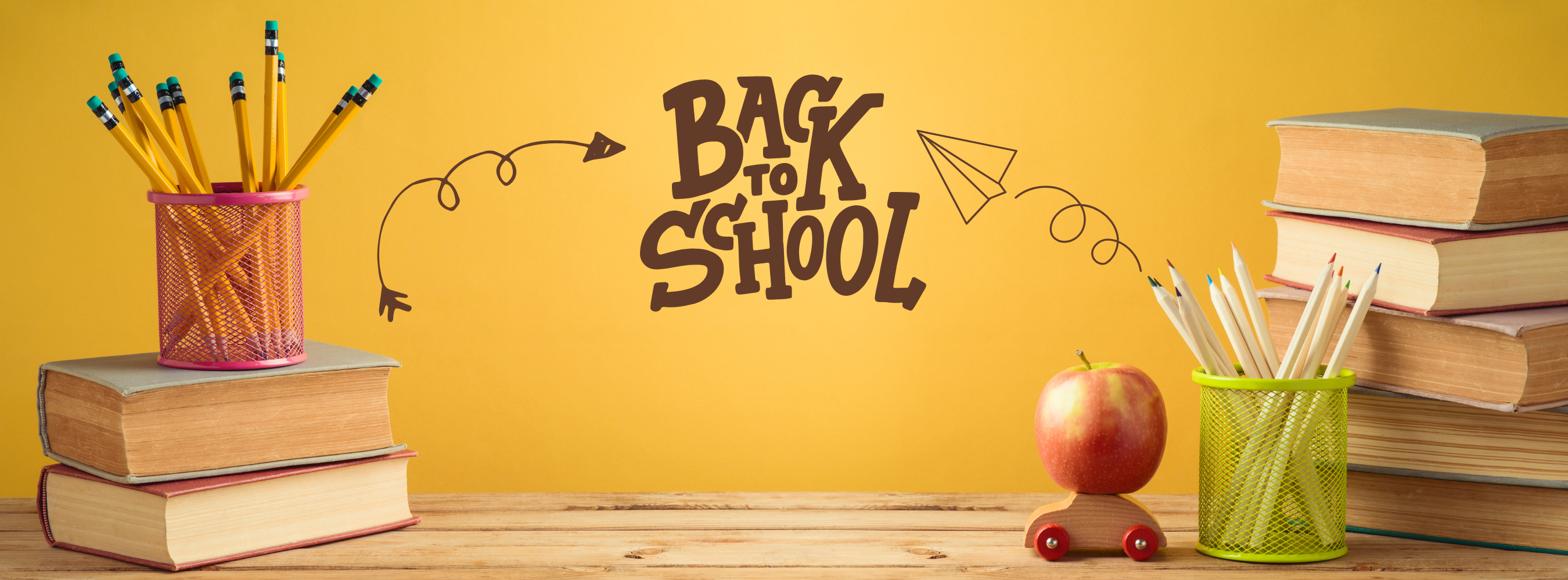 mustard color background with the title back to school and books and a cup of pencils and an apple