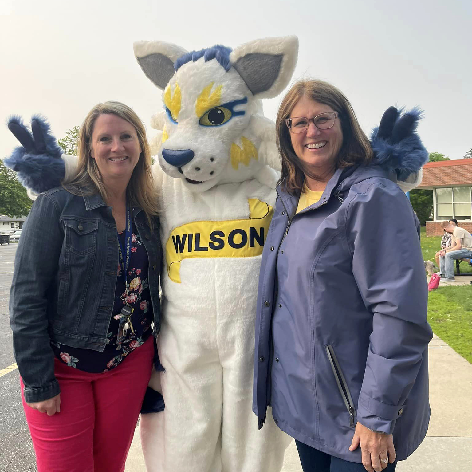 Principal and assistant principal with the mascot, Wilson