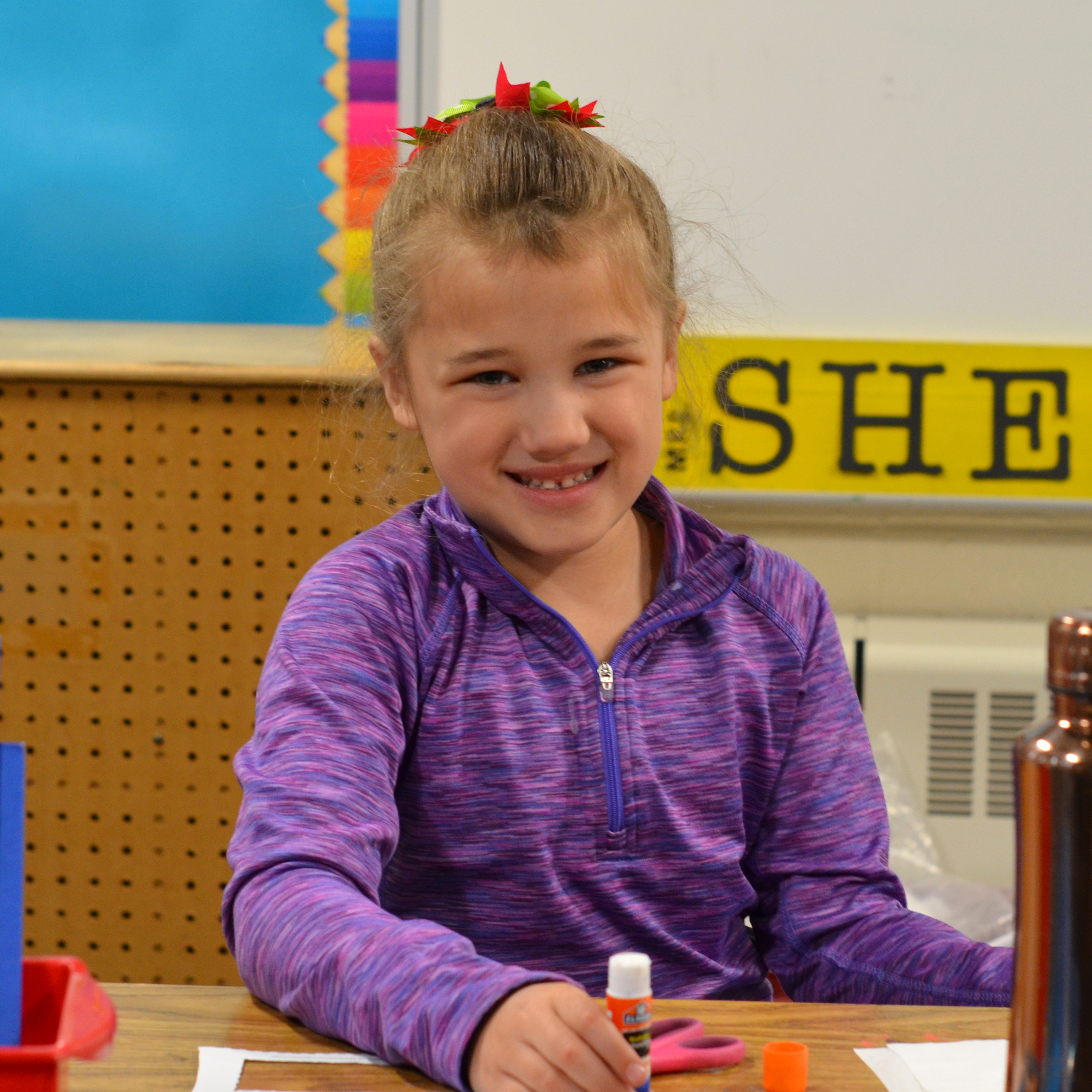 A student smiling at the camera